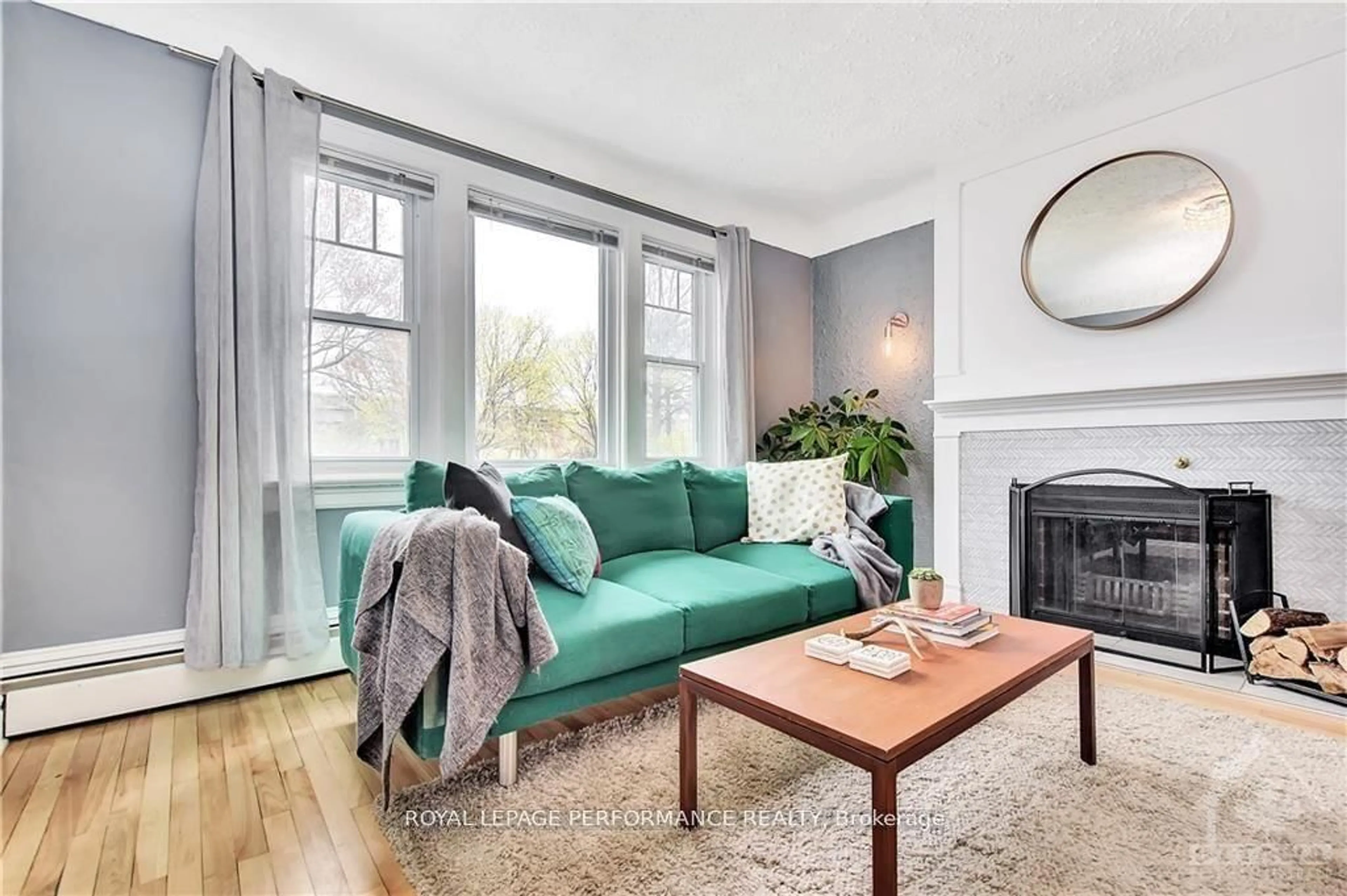 Living room with furniture, wood/laminate floor for 48 HAWTHORNE Ave, Ottawa Ontario K1S 0B1