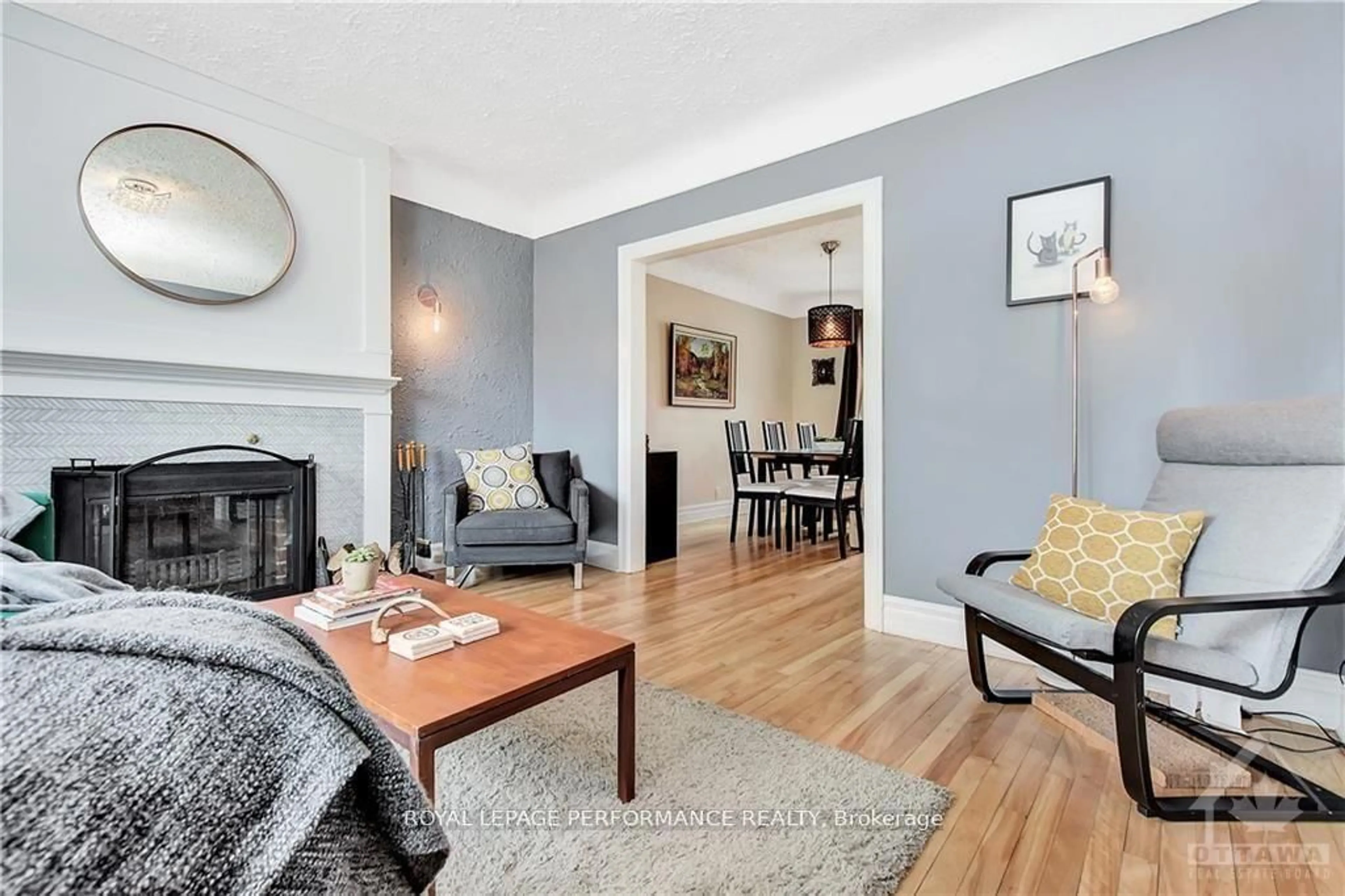 Living room with furniture, wood/laminate floor for 48 HAWTHORNE Ave, Ottawa Ontario K1S 0B1