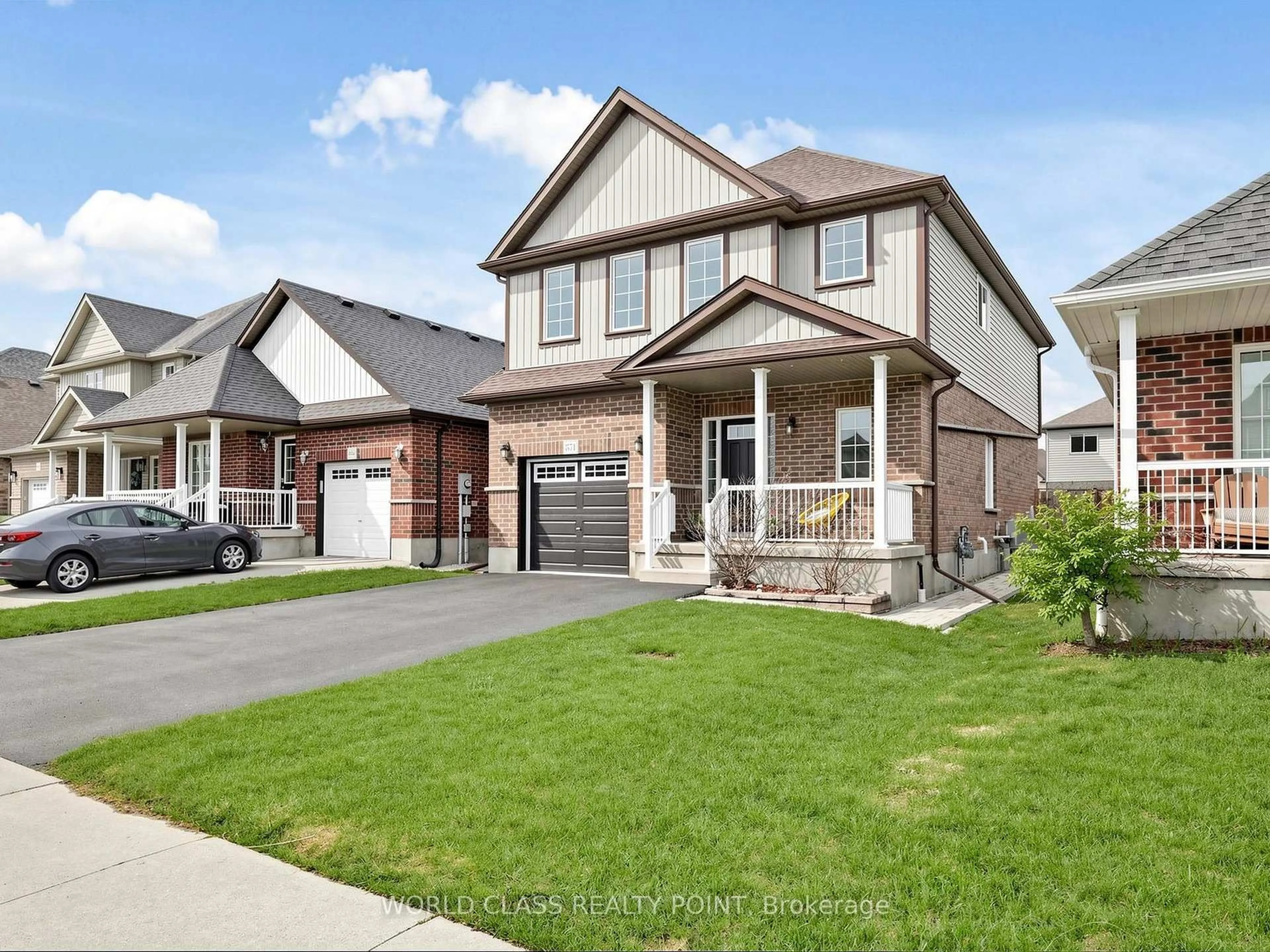 Home with brick exterior material, street for 371 Finoro Cres, Woolwich Ontario N3B 0C4