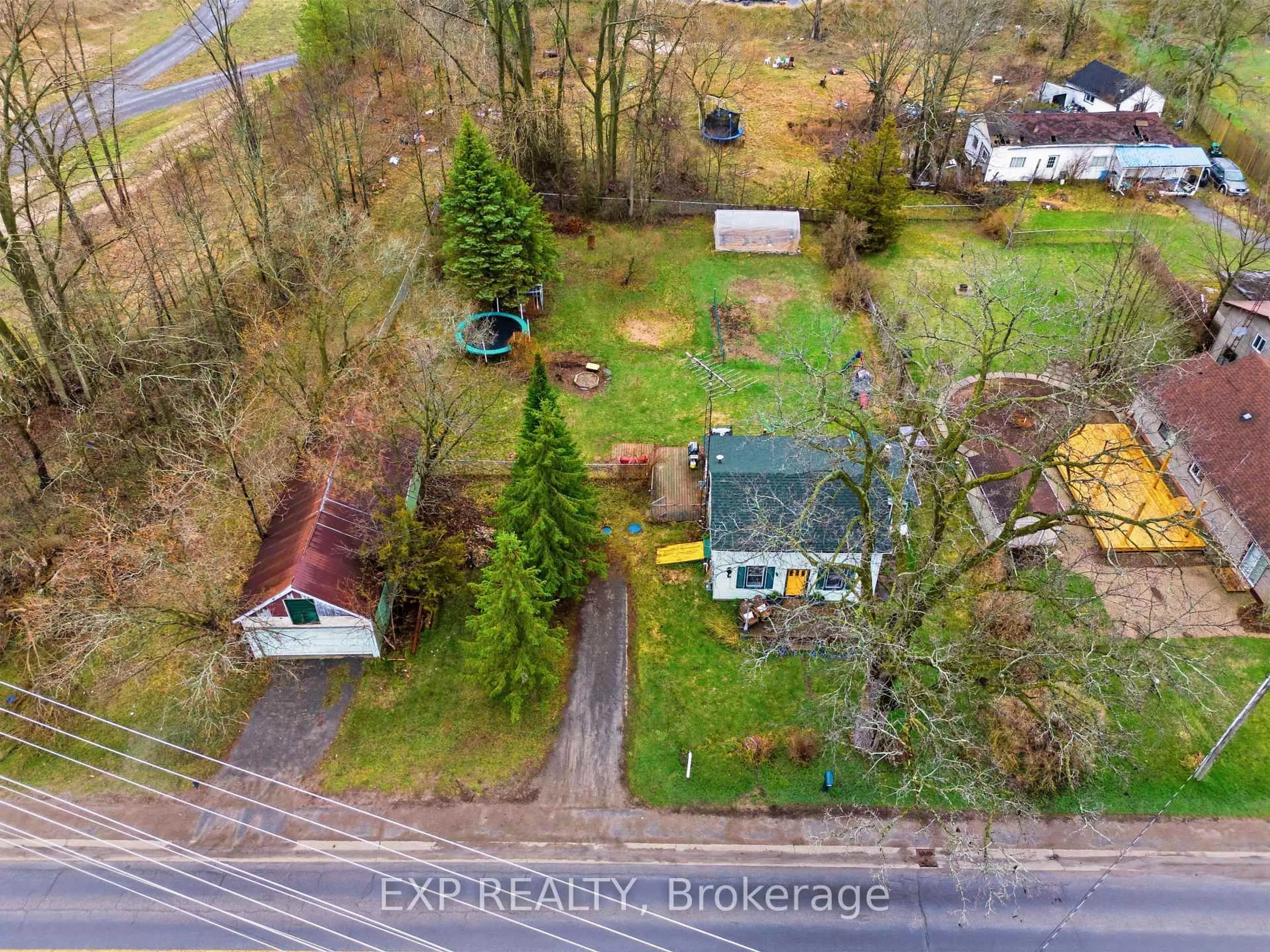 A pic from outside/outdoor area/front of a property/back of a property/a pic from drone, street for 52 County 1 Rd, Prince Edward County Ontario K0K 2T0