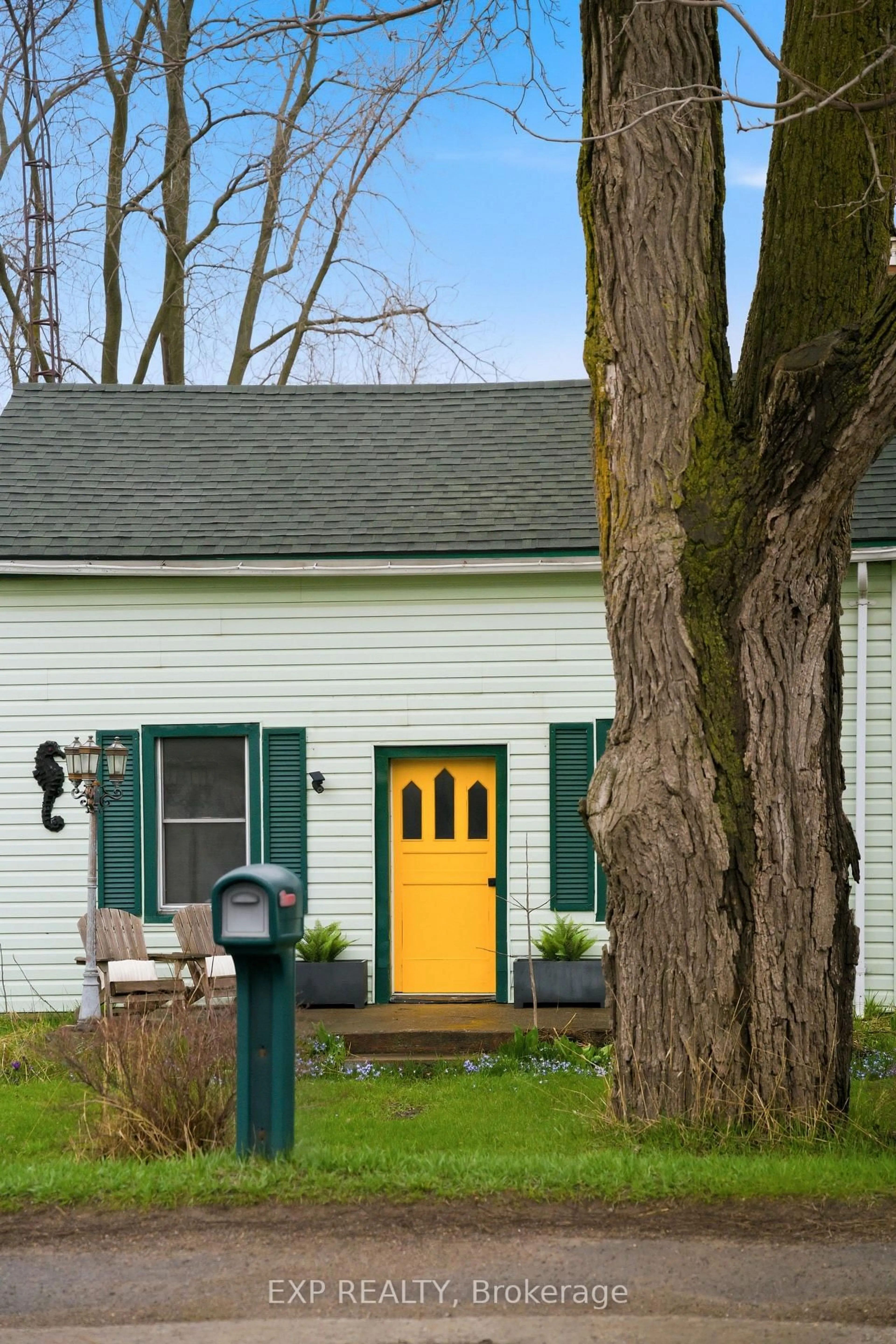 Home with vinyl exterior material, street for 52 County 1 Rd, Prince Edward County Ontario K0K 2T0