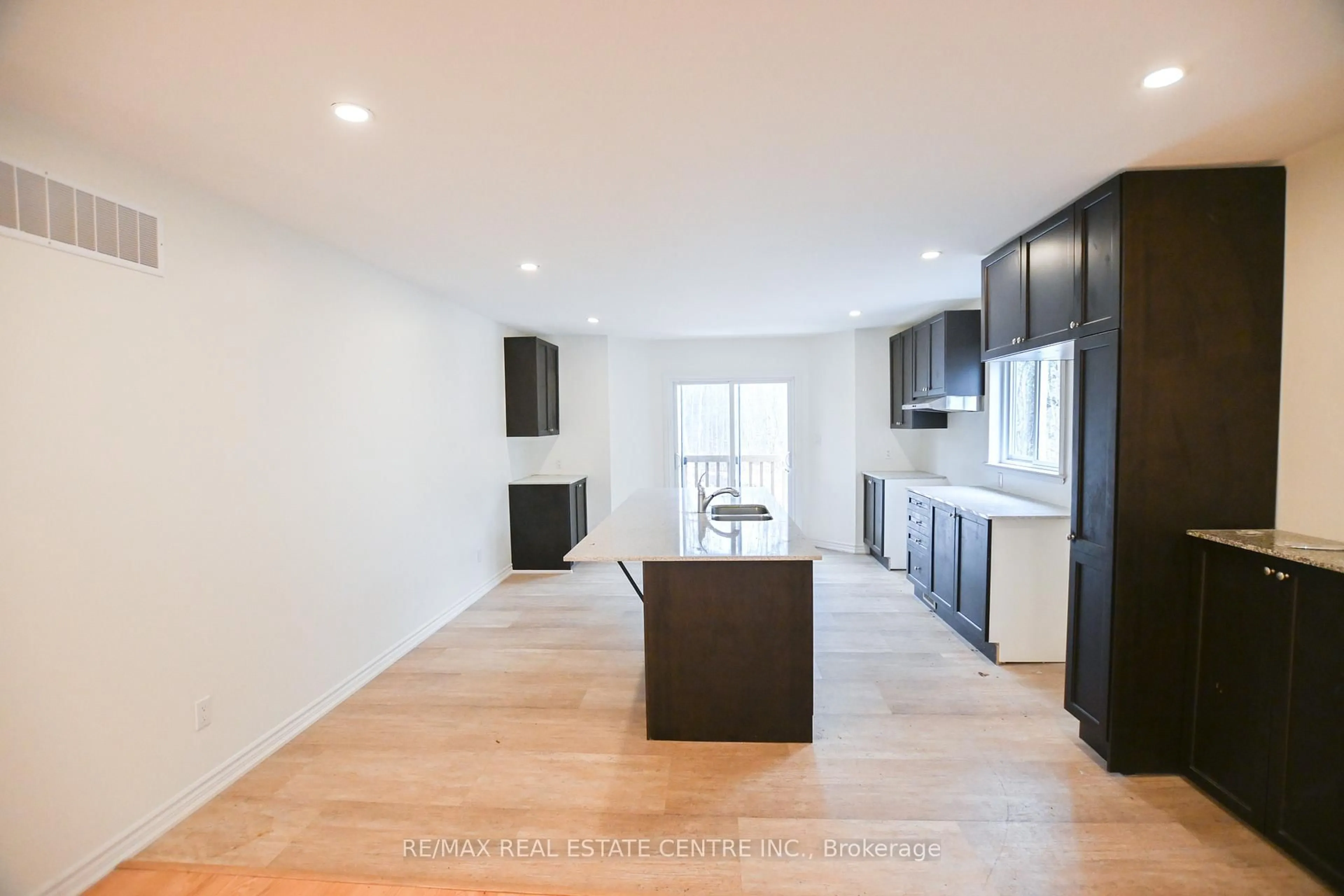 Open concept kitchen, wood/laminate floor for 1078 South Kahshe Lake Rd, Gravenhurst Ontario P0E 1G0