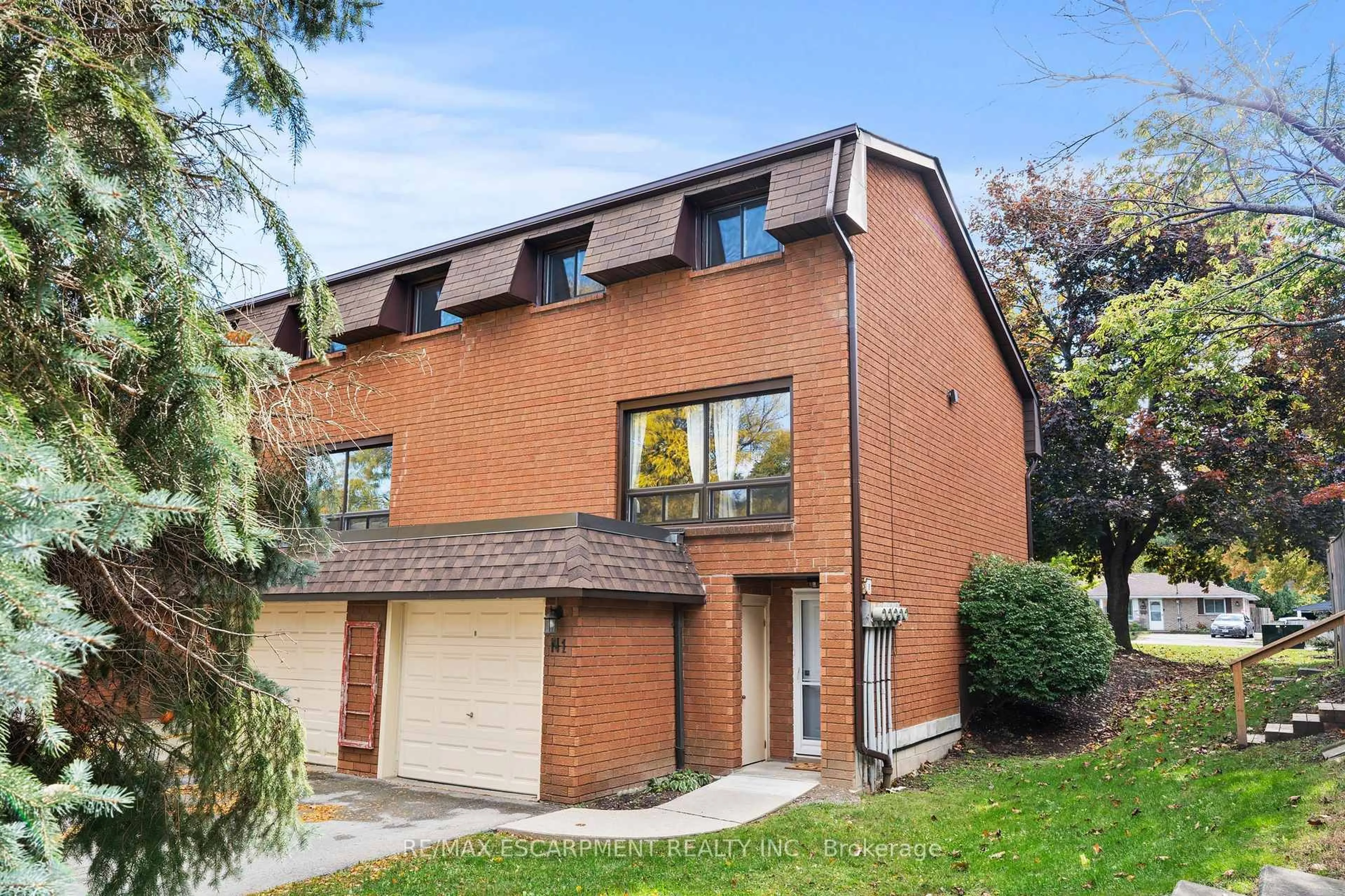 Home with brick exterior material, street for 444 Stone Church Rd #N1, Hamilton Ontario L9B 1R1