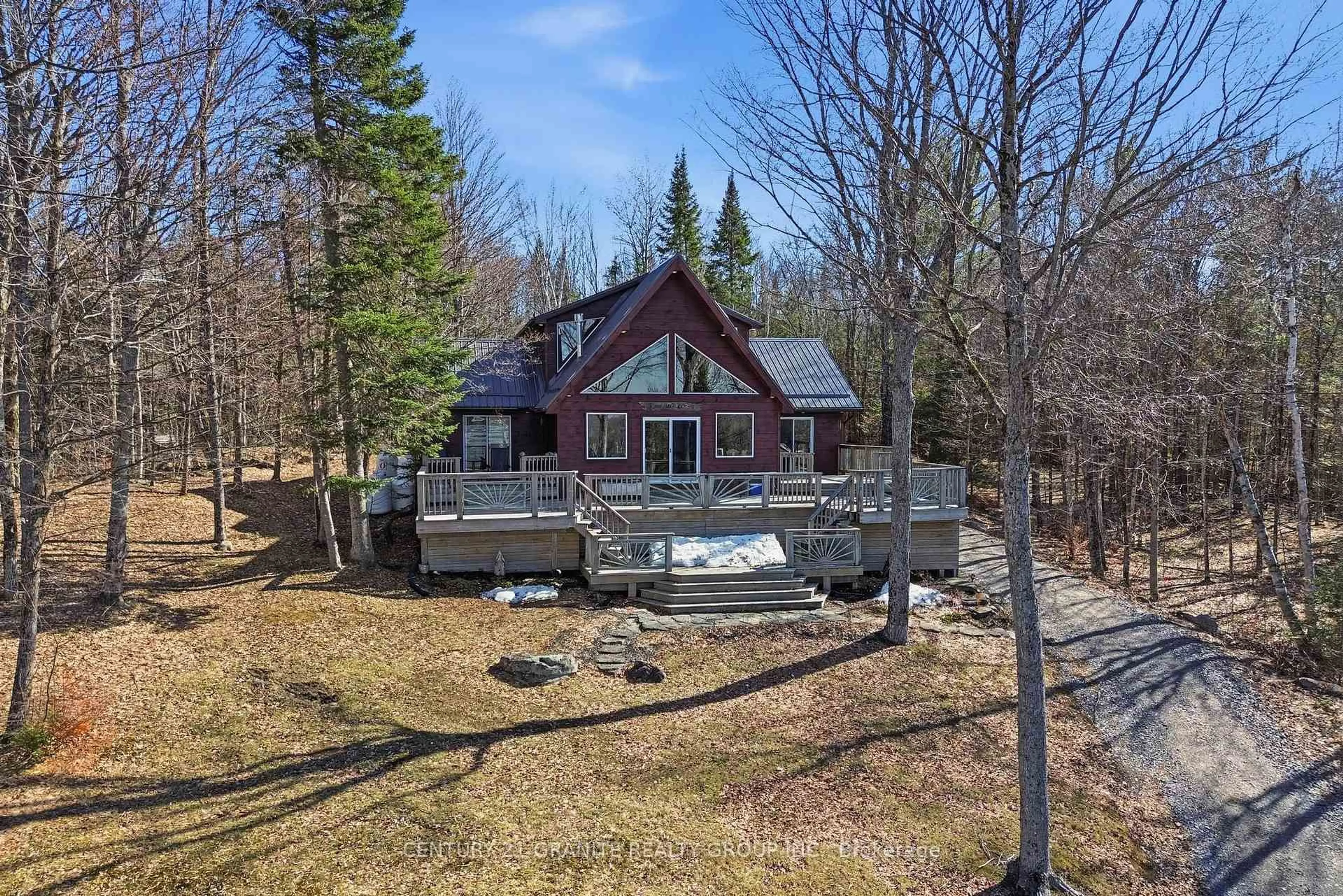 A pic from outside/outdoor area/front of a property/back of a property/a pic from drone, water/lake/river/ocean view for 27158 Highway 28 South, Highlands East Ontario K0L 1C0