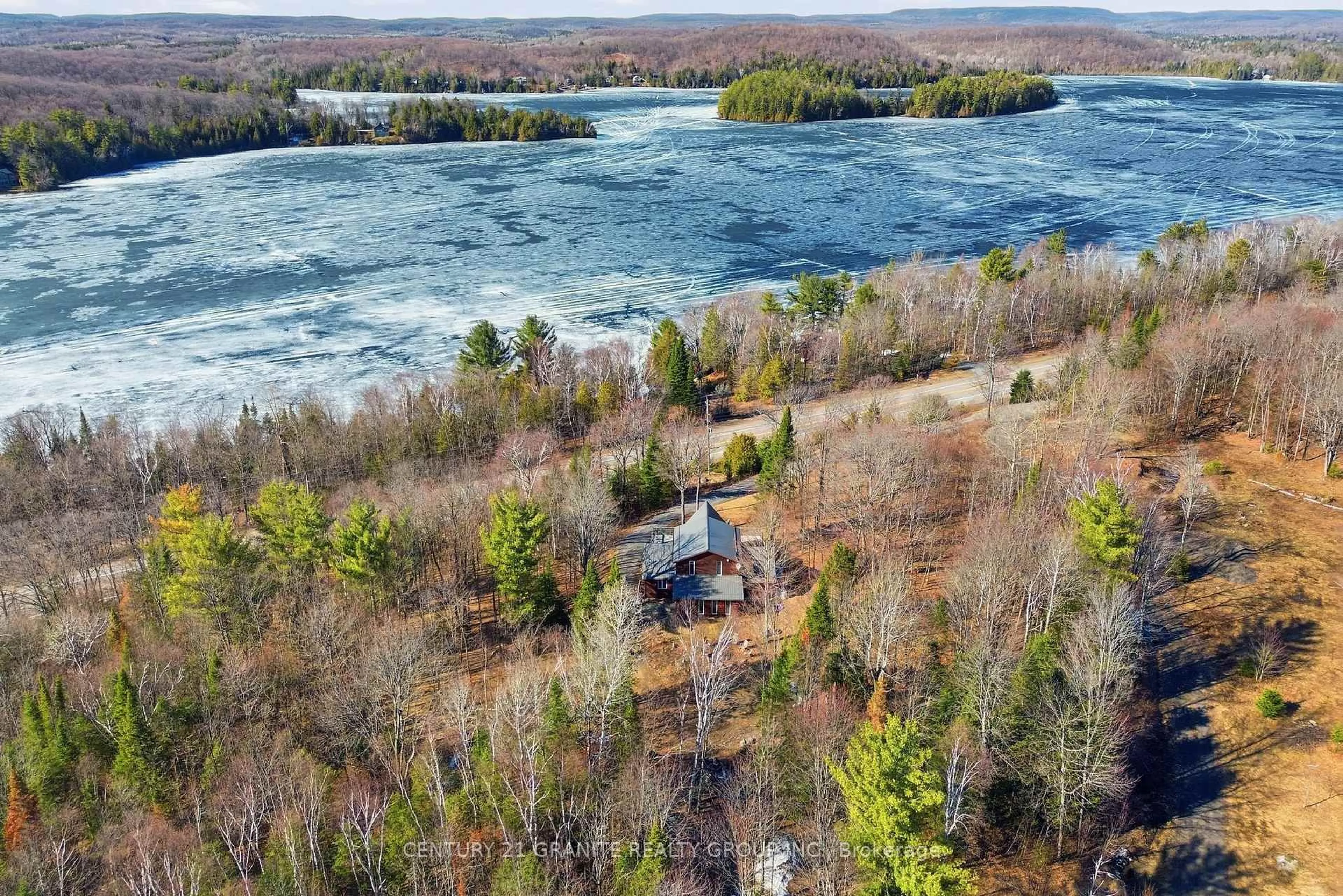 A pic from outside/outdoor area/front of a property/back of a property/a pic from drone, water/lake/river/ocean view for 27158 Highway 28 South, Highlands East Ontario K0L 1C0