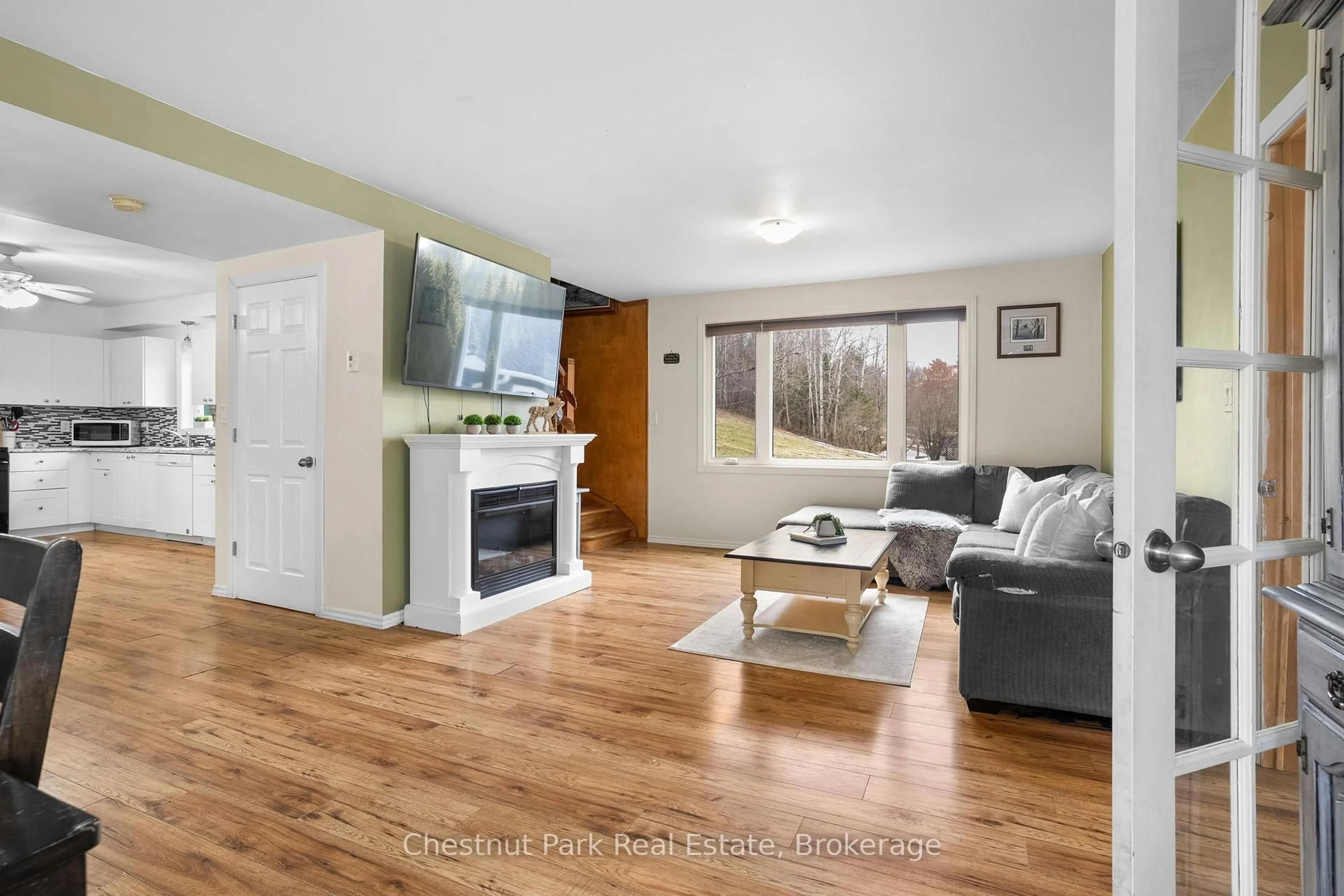 Living room with furniture, wood/laminate floor for 96 James St, Burk's Falls Ontario P0A 1C0
