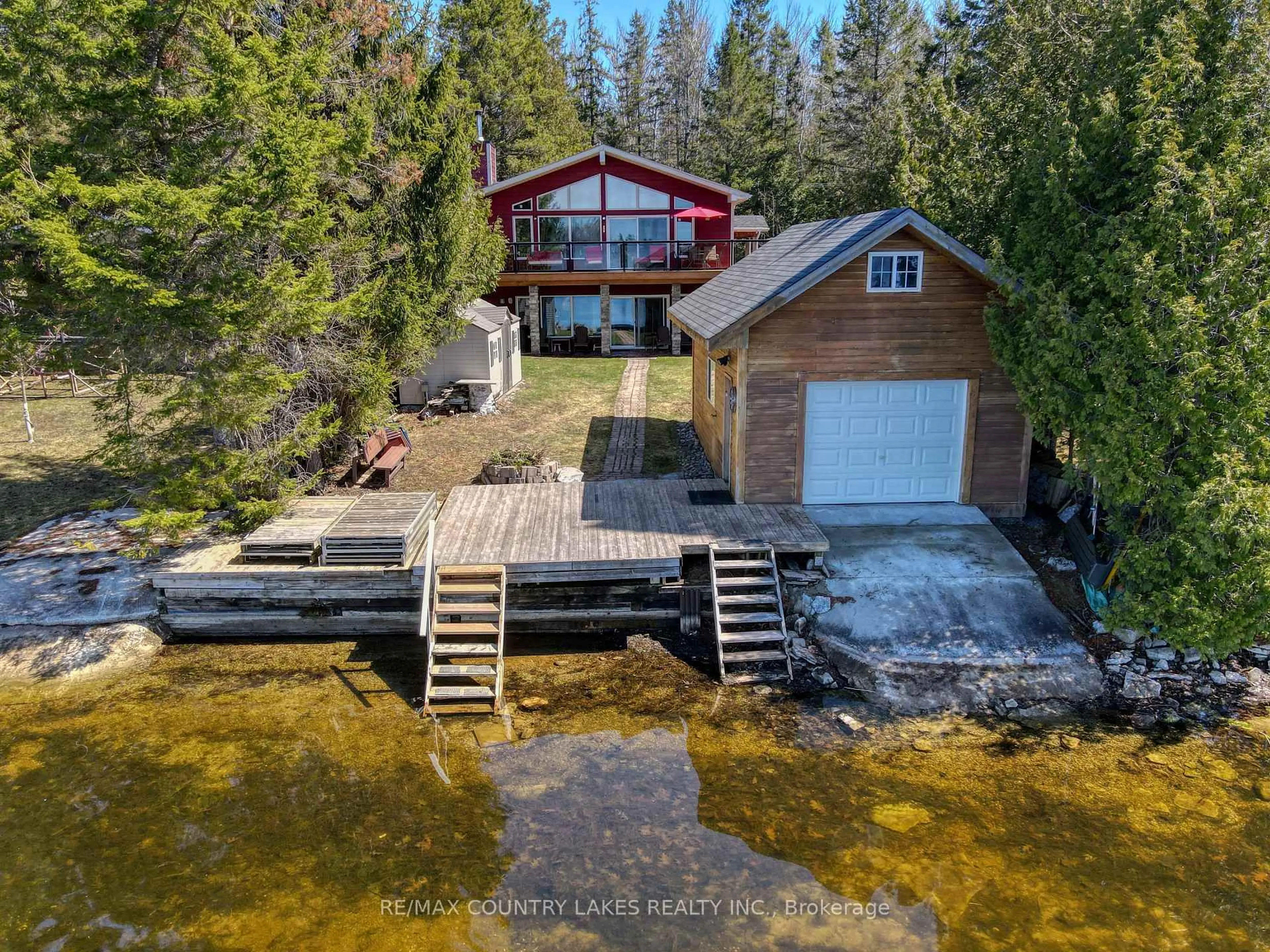 A pic from outside/outdoor area/front of a property/back of a property/a pic from drone, water/lake/river/ocean view for 87 Paradise Rd, Kawartha Lakes Ontario K0M 1B0