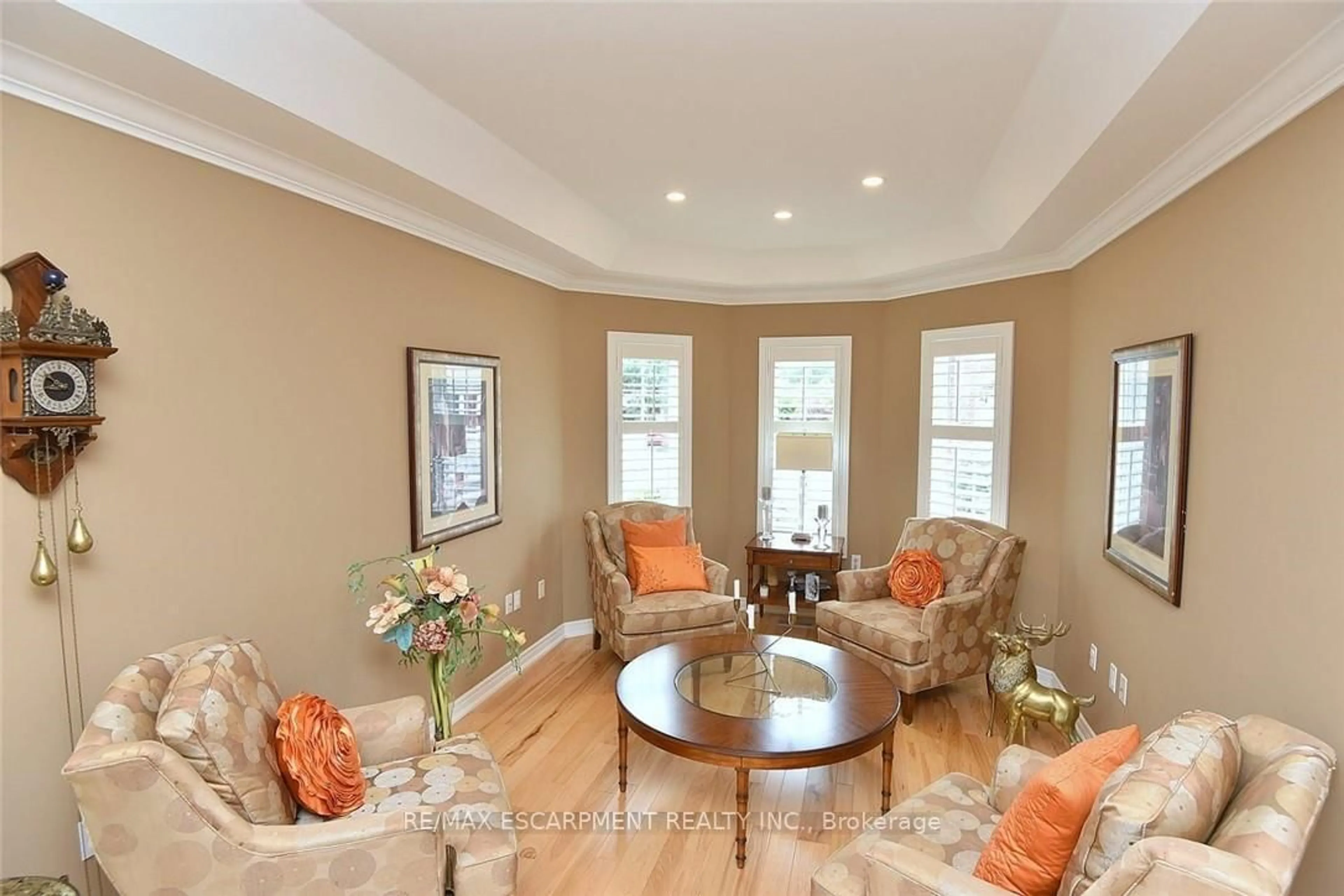 Living room with furniture, wood/laminate floor for 97 Sunvale Pl #5, Hamilton Ontario L8E 4Z7