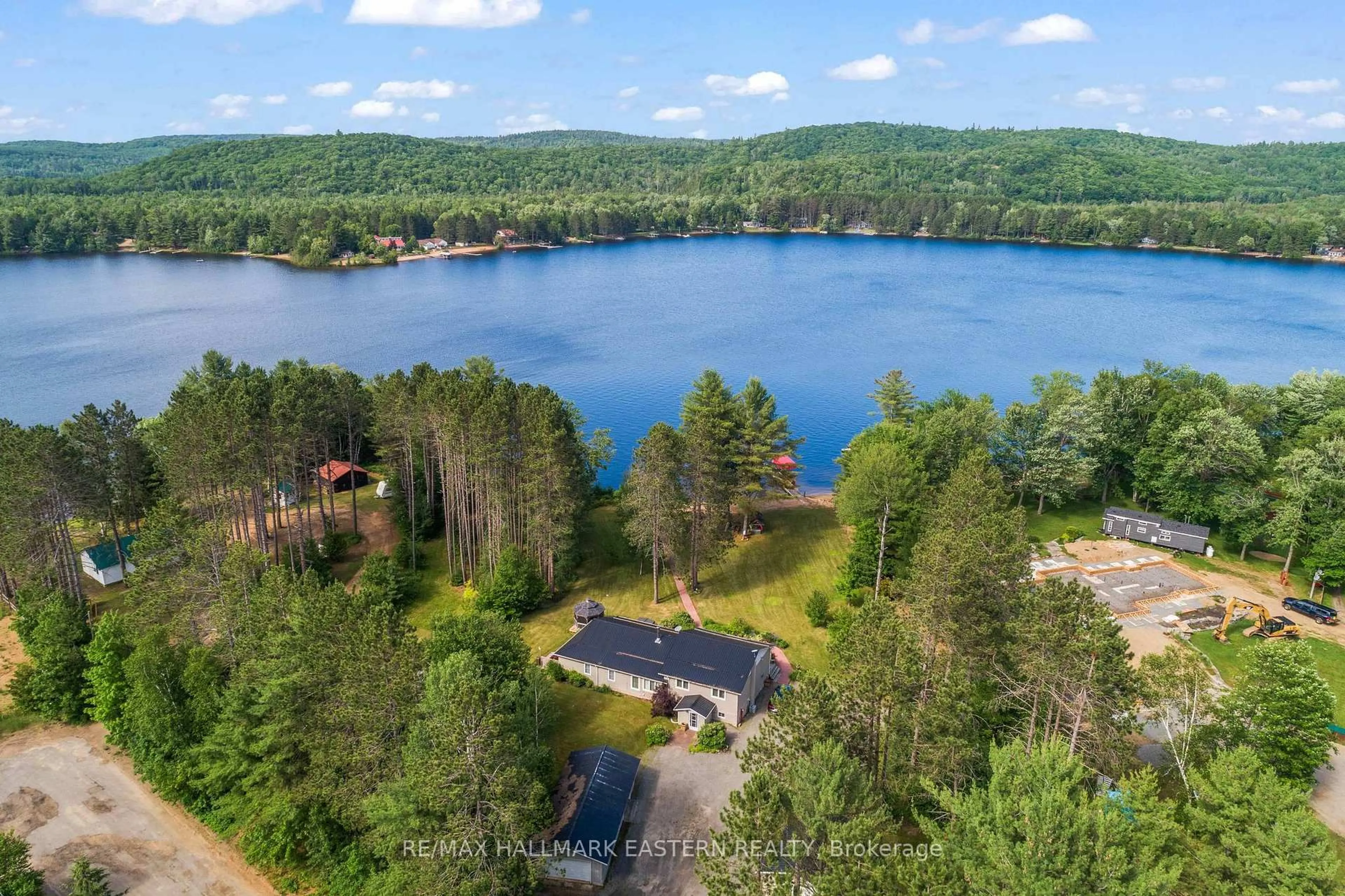 A pic from outside/outdoor area/front of a property/back of a property/a pic from drone, water/lake/river/ocean view for 118 Annie Mayhew Rd, Combermere Ontario K0J 1L0