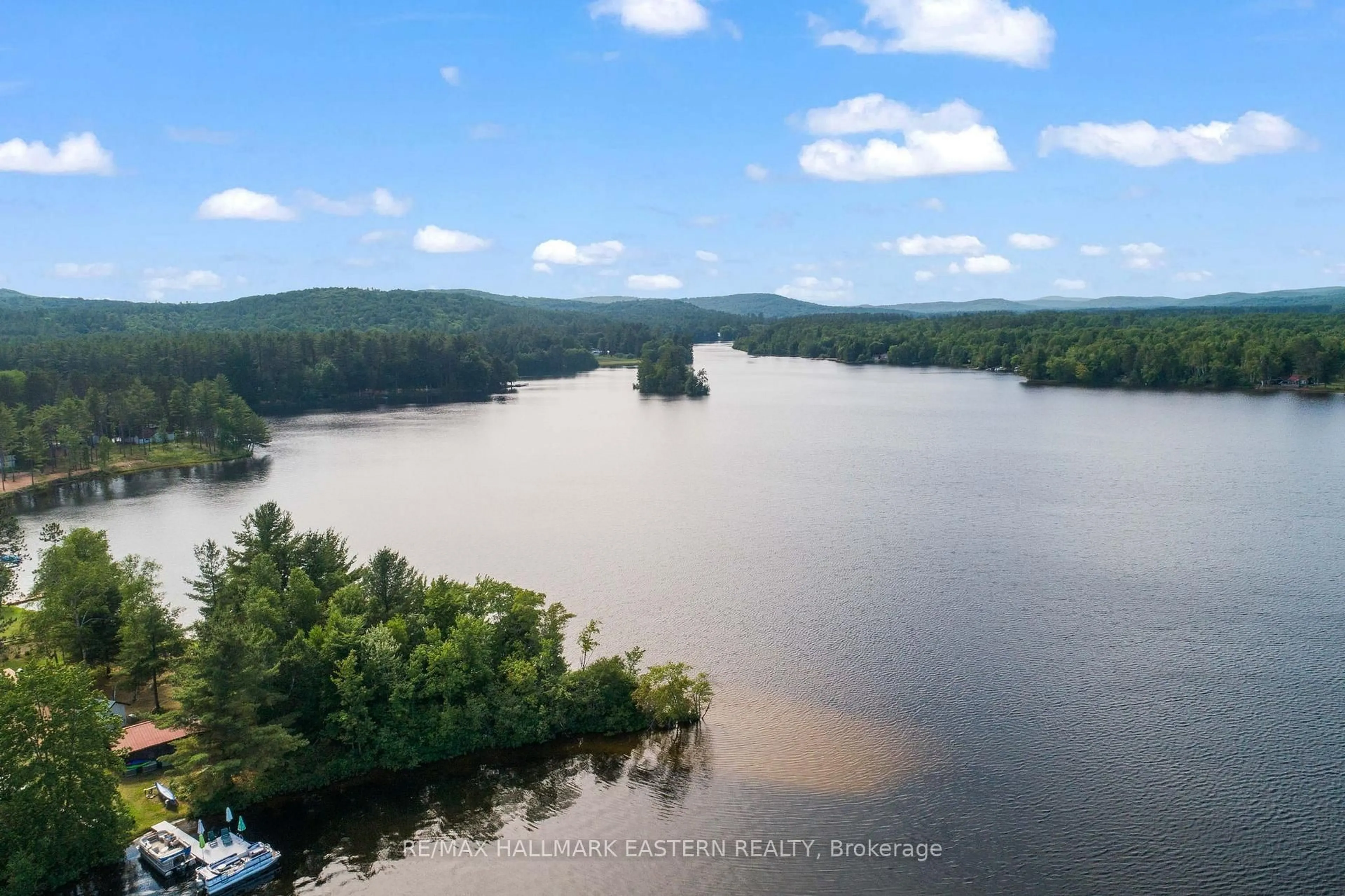 A pic from outside/outdoor area/front of a property/back of a property/a pic from drone, water/lake/river/ocean view for 118 Annie Mayhew Rd, Combermere Ontario K0J 1L0
