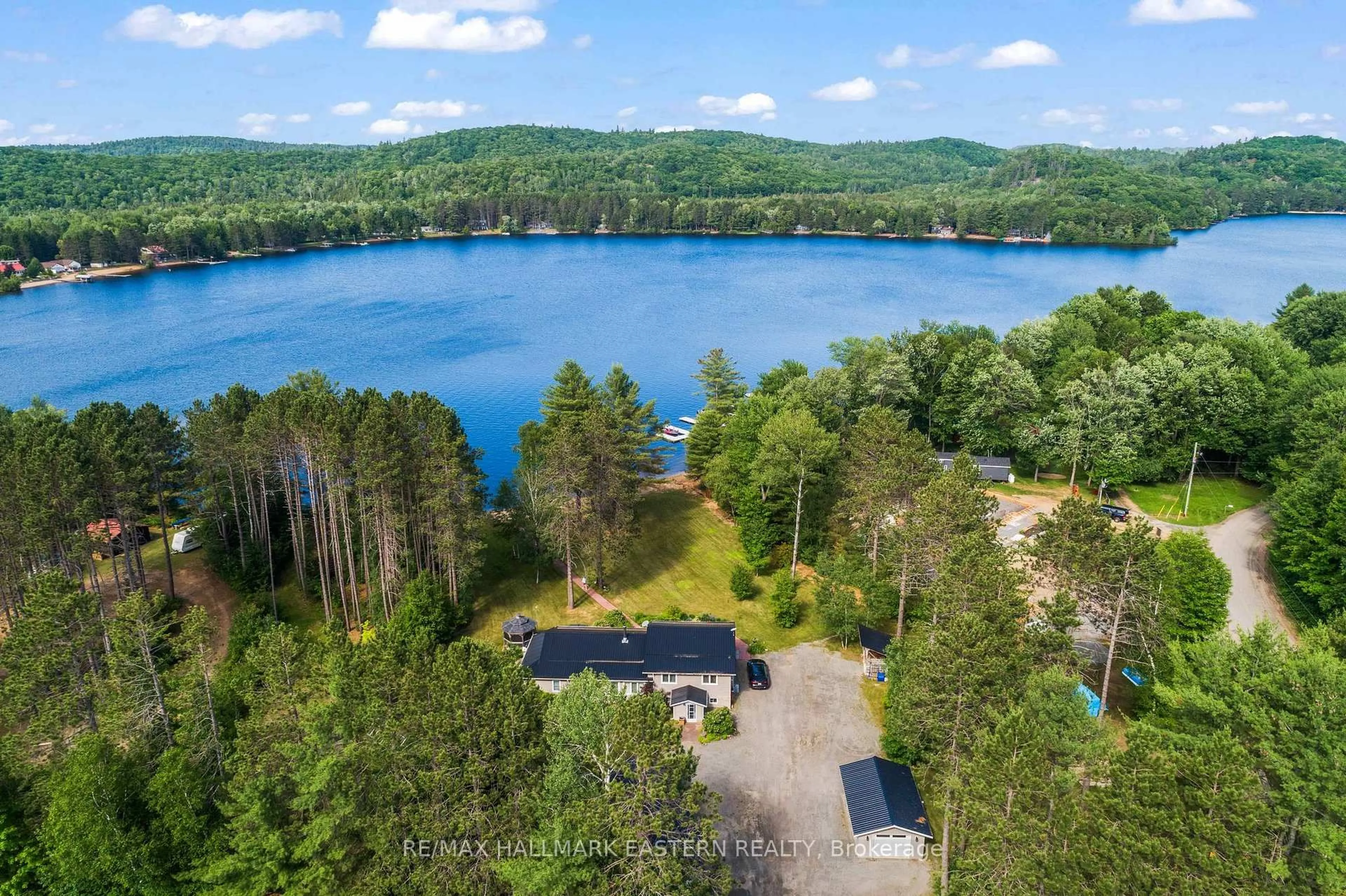 A pic from outside/outdoor area/front of a property/back of a property/a pic from drone, water/lake/river/ocean view for 118 Annie Mayhew Rd, Combermere Ontario K0J 1L0