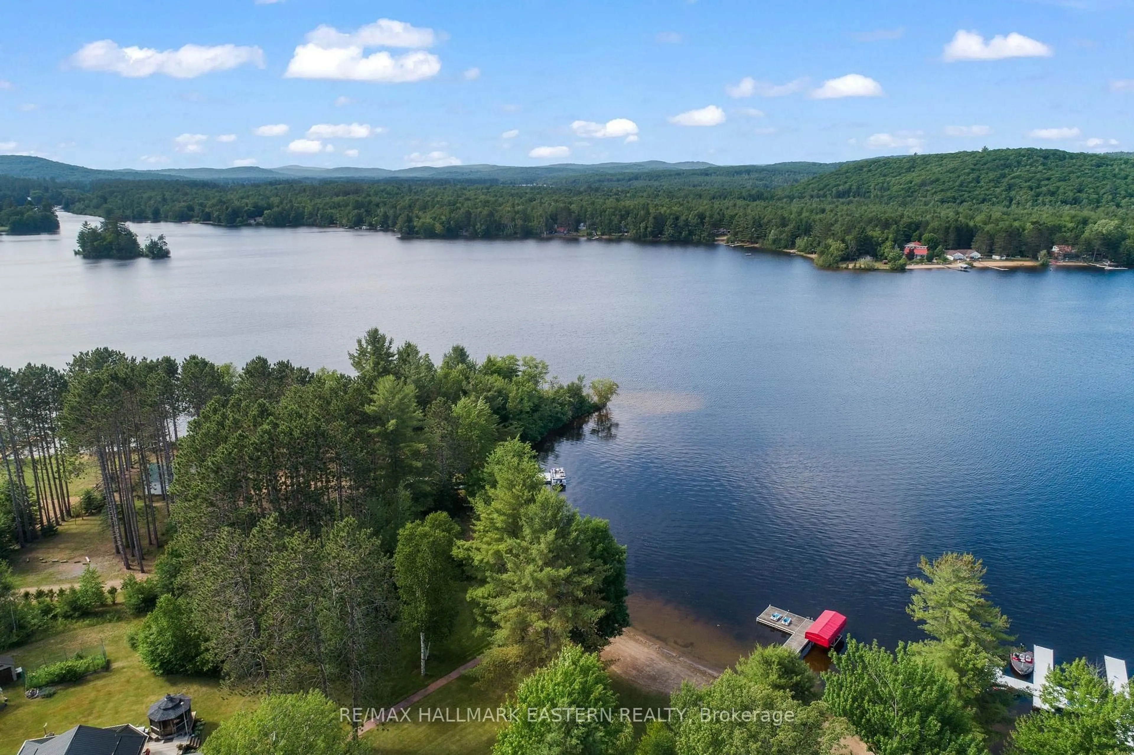A pic from outside/outdoor area/front of a property/back of a property/a pic from drone, water/lake/river/ocean view for 118 Annie Mayhew Rd, Combermere Ontario K0J 1L0