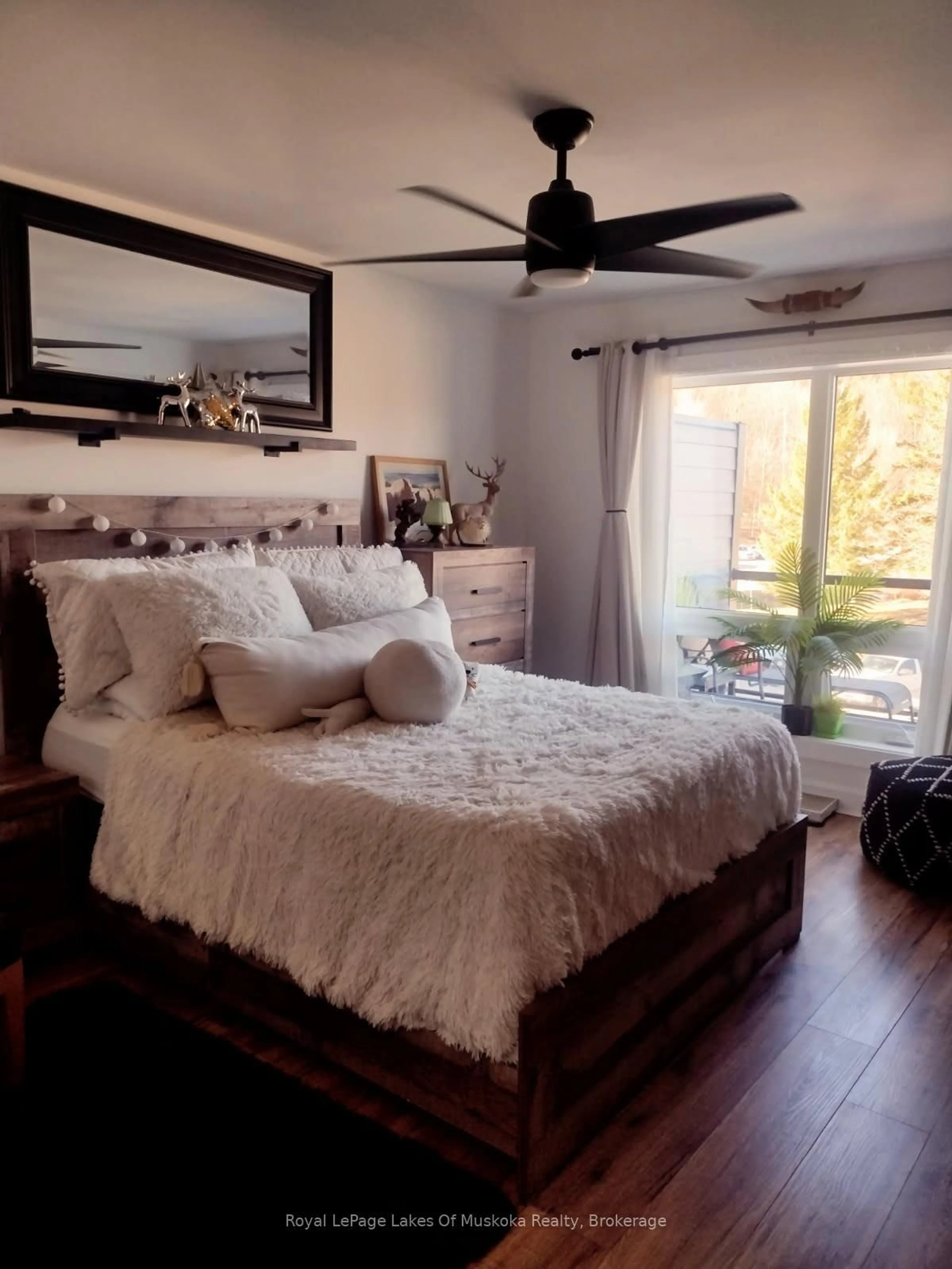 Bedroom with bed, wood/laminate floor for 54 Summit DRIVE Dr #301, Huntsville Ontario P1H 2E8