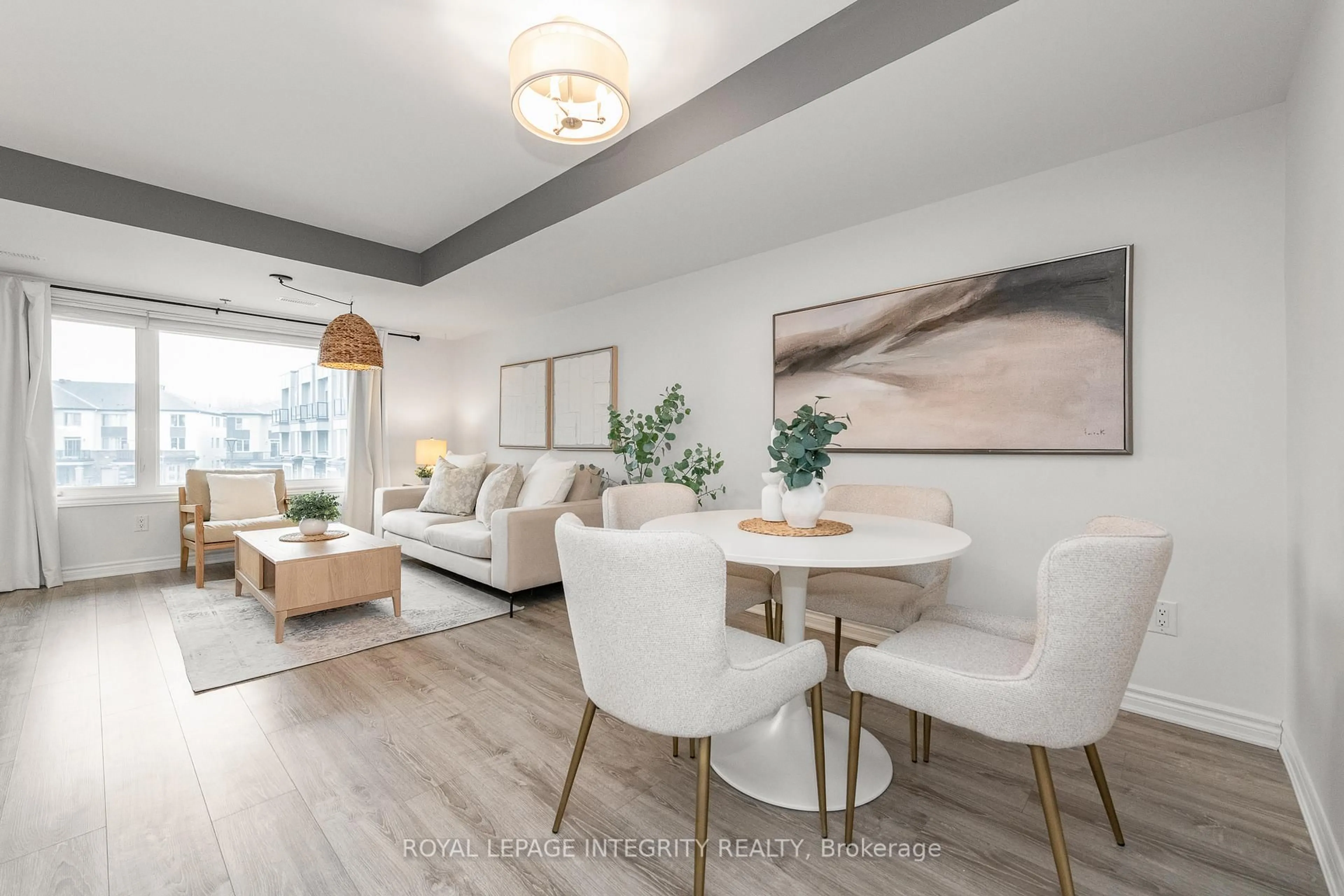 Living room with furniture, wood/laminate floor for 541 Takamose Private #138, Ottawa Ontario K1K 5A5