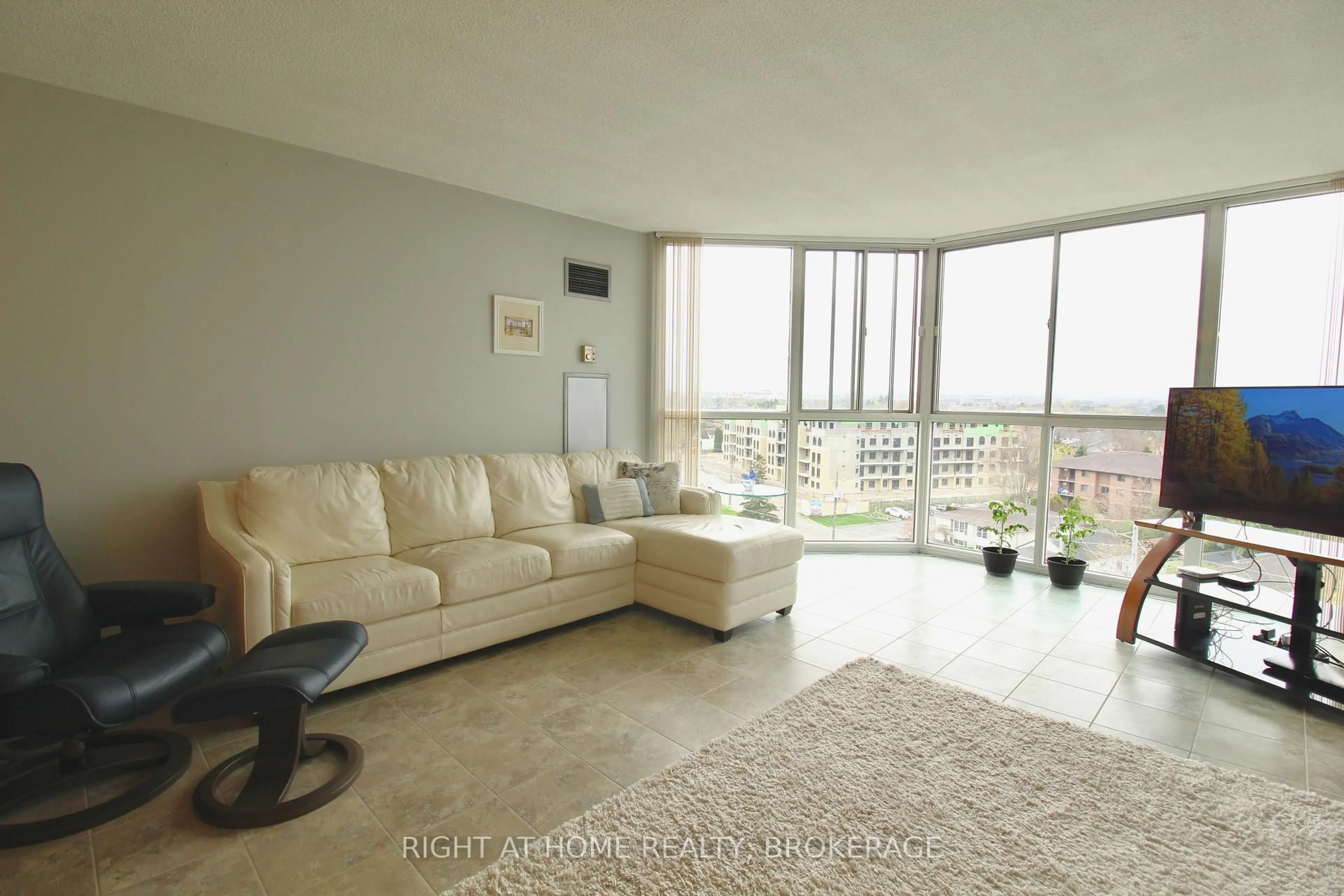 Living room with furniture, unknown for 162 Martindale Rd #801, St. Catharines Ontario L2S 3S4