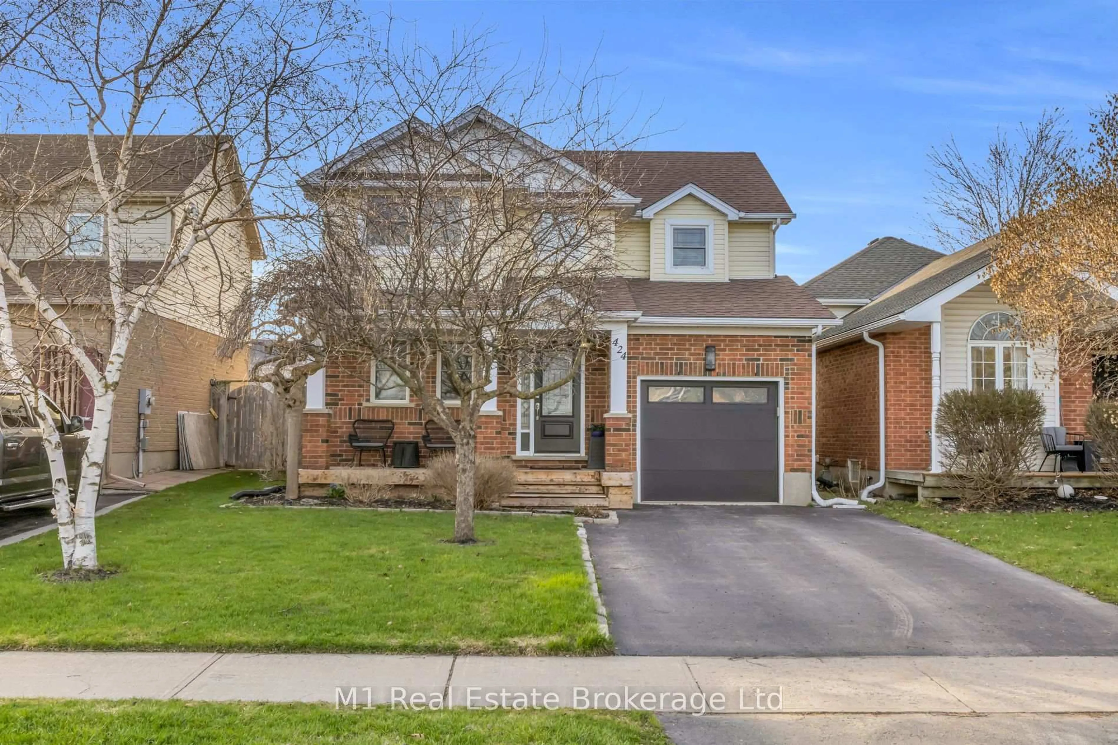 Home with brick exterior material, street for 424 MILLBURN Blvd, Centre Wellington Ontario N1M 3R5