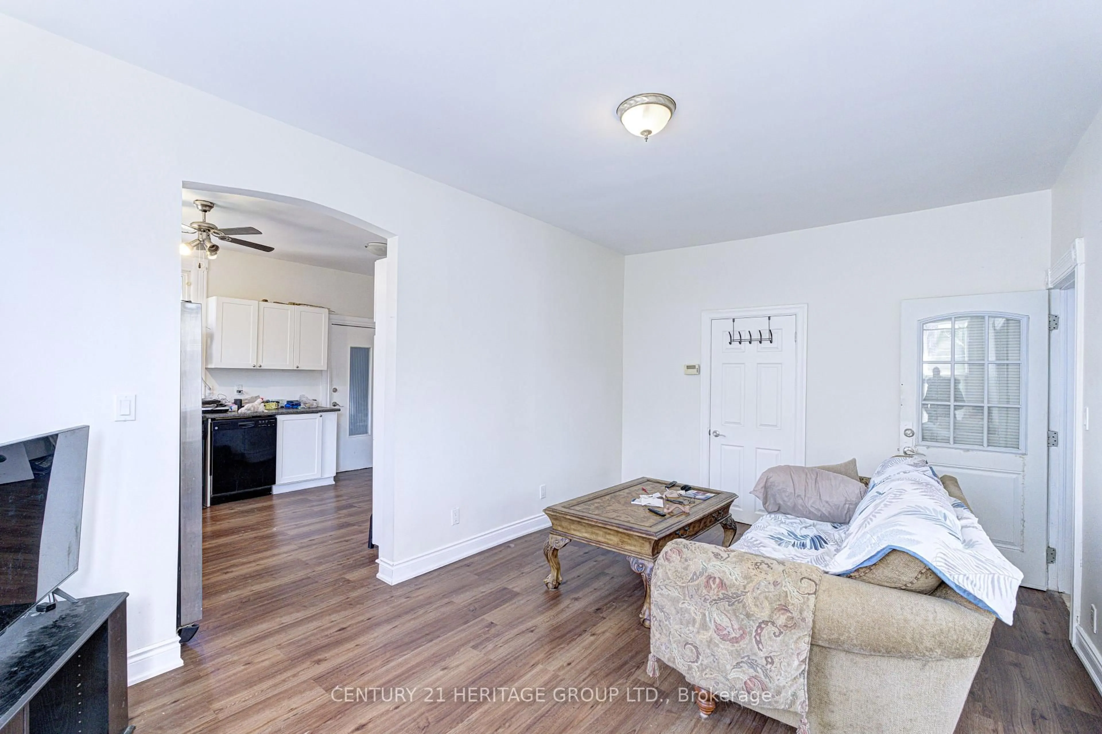 Living room with furniture, wood/laminate floor for 243 Gibson Ave, Hamilton Ontario L8L 6K3