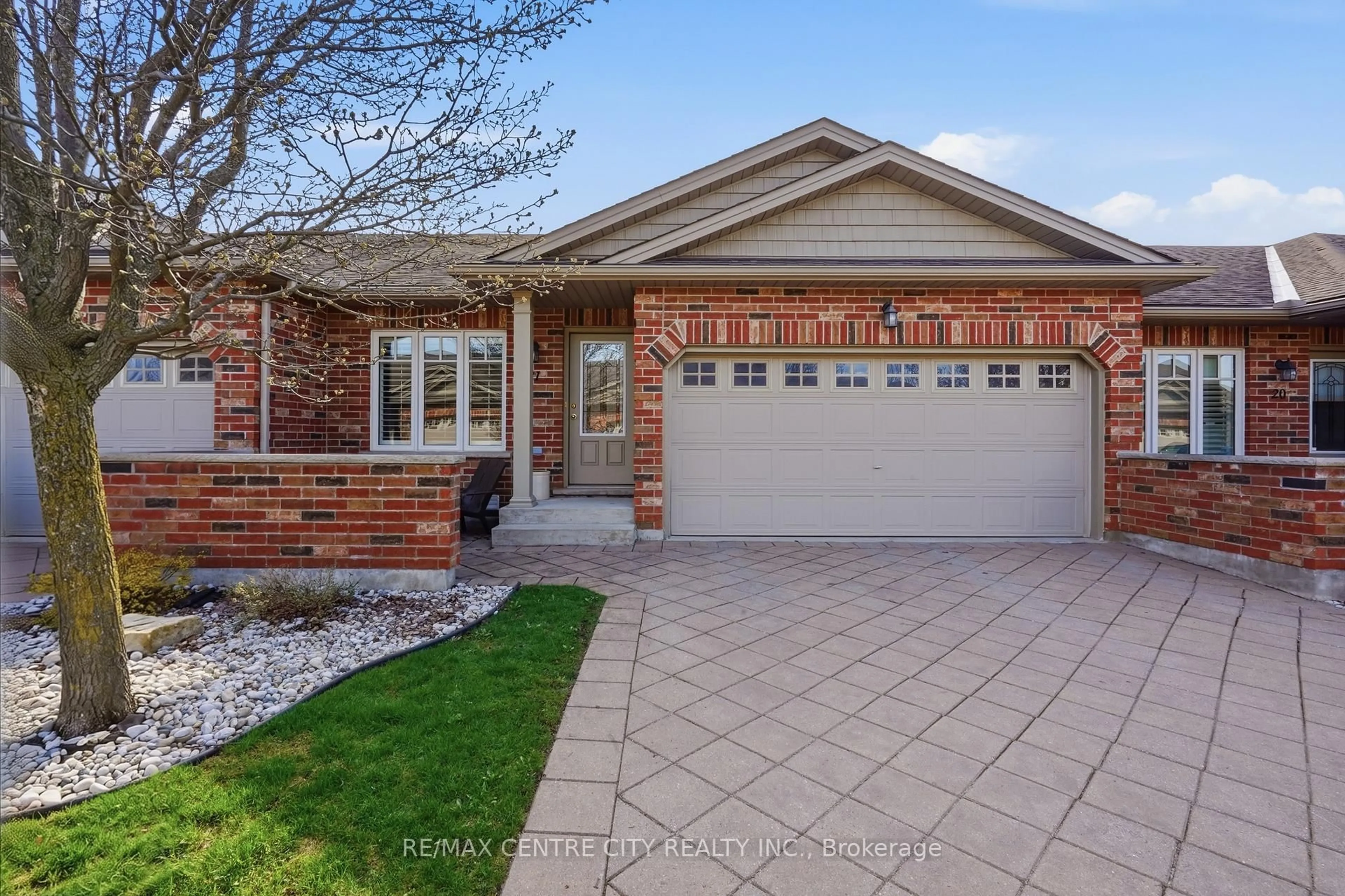 Home with brick exterior material, street for 121 Meadowcreek Dr #21, Middlesex Centre Ontario N0M 2A0