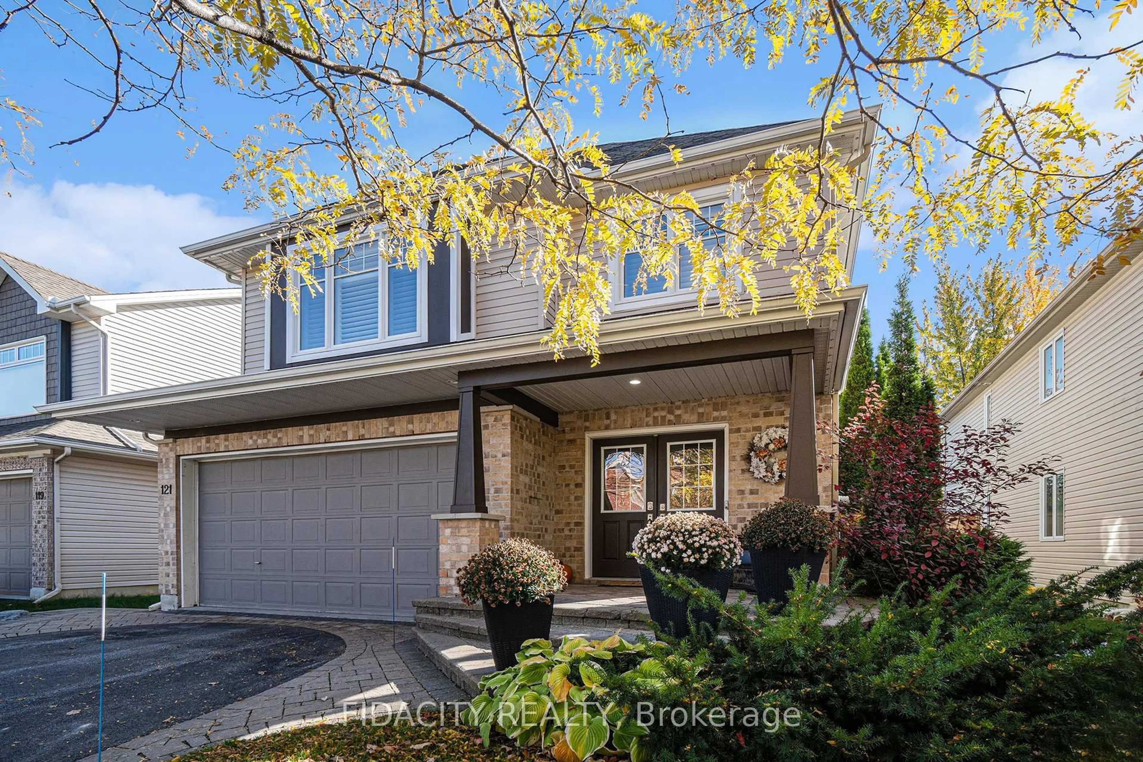 Home with brick exterior material, street for 121 Bandelier Way, Ottawa Ontario K2S 0C2