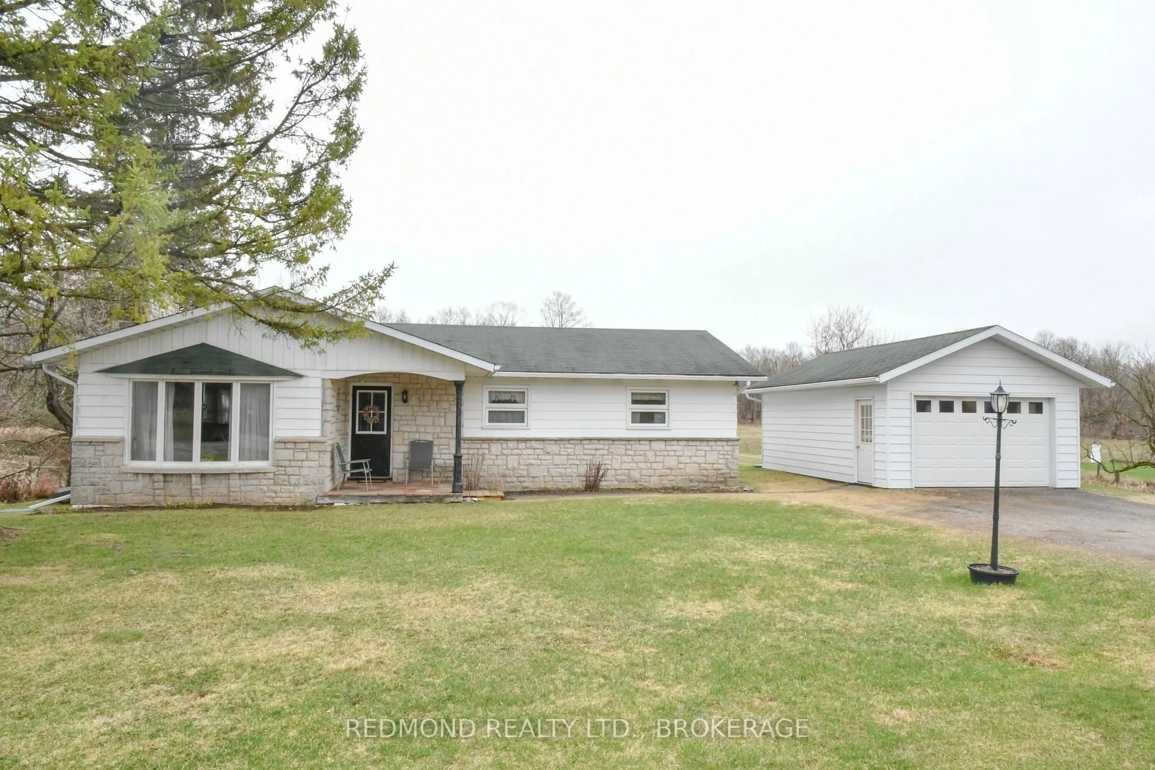 A pic from outside/outdoor area/front of a property/back of a property/a pic from drone, street for 1319 County Rd 2 Rd, Leeds and the Thousand Islands Ontario K0E 1L0