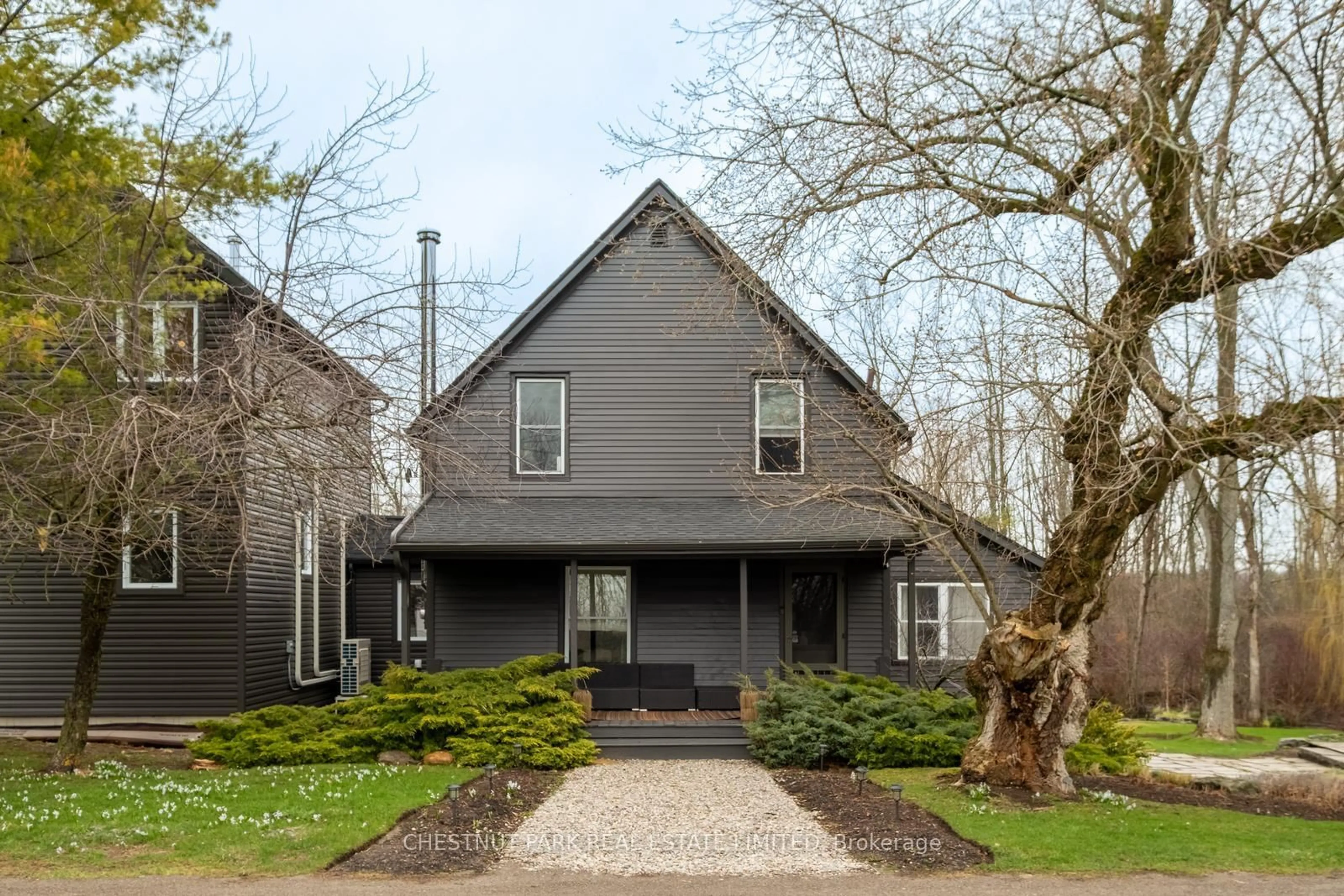 Home with vinyl exterior material, street for 709 Old Milford Rd, Prince Edward County Ontario K0K 2T0