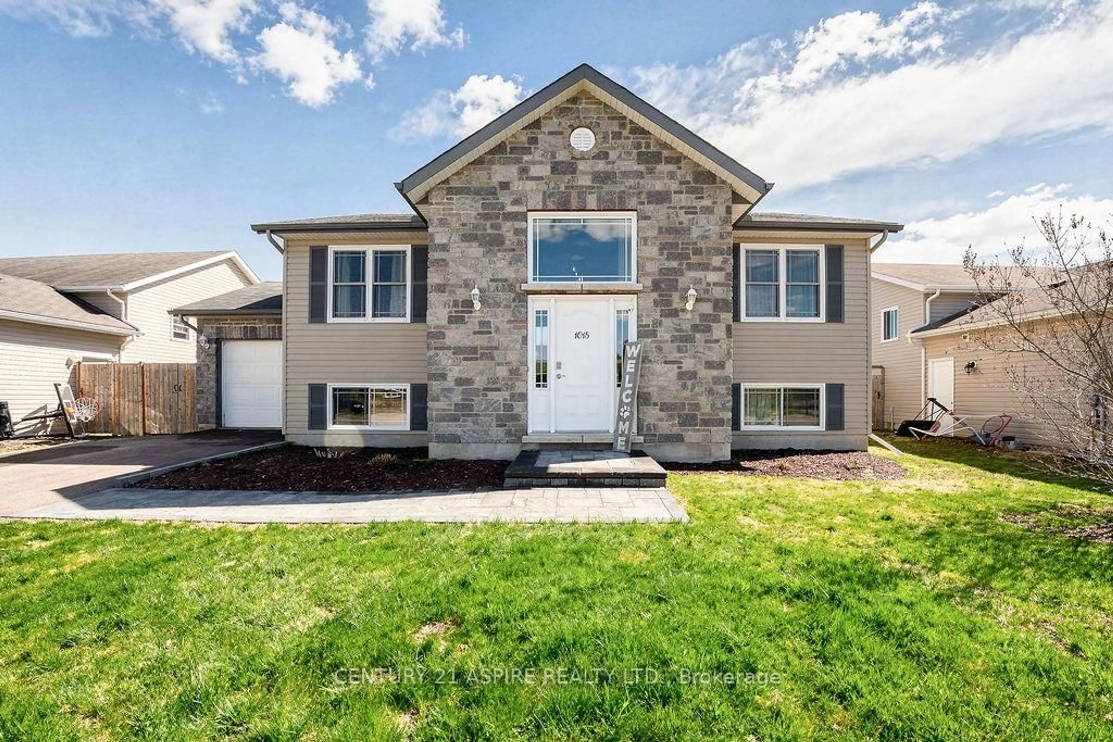 Home with brick exterior material, street for 1015 Riverstone Tr, Petawawa Ontario K8H 0B3