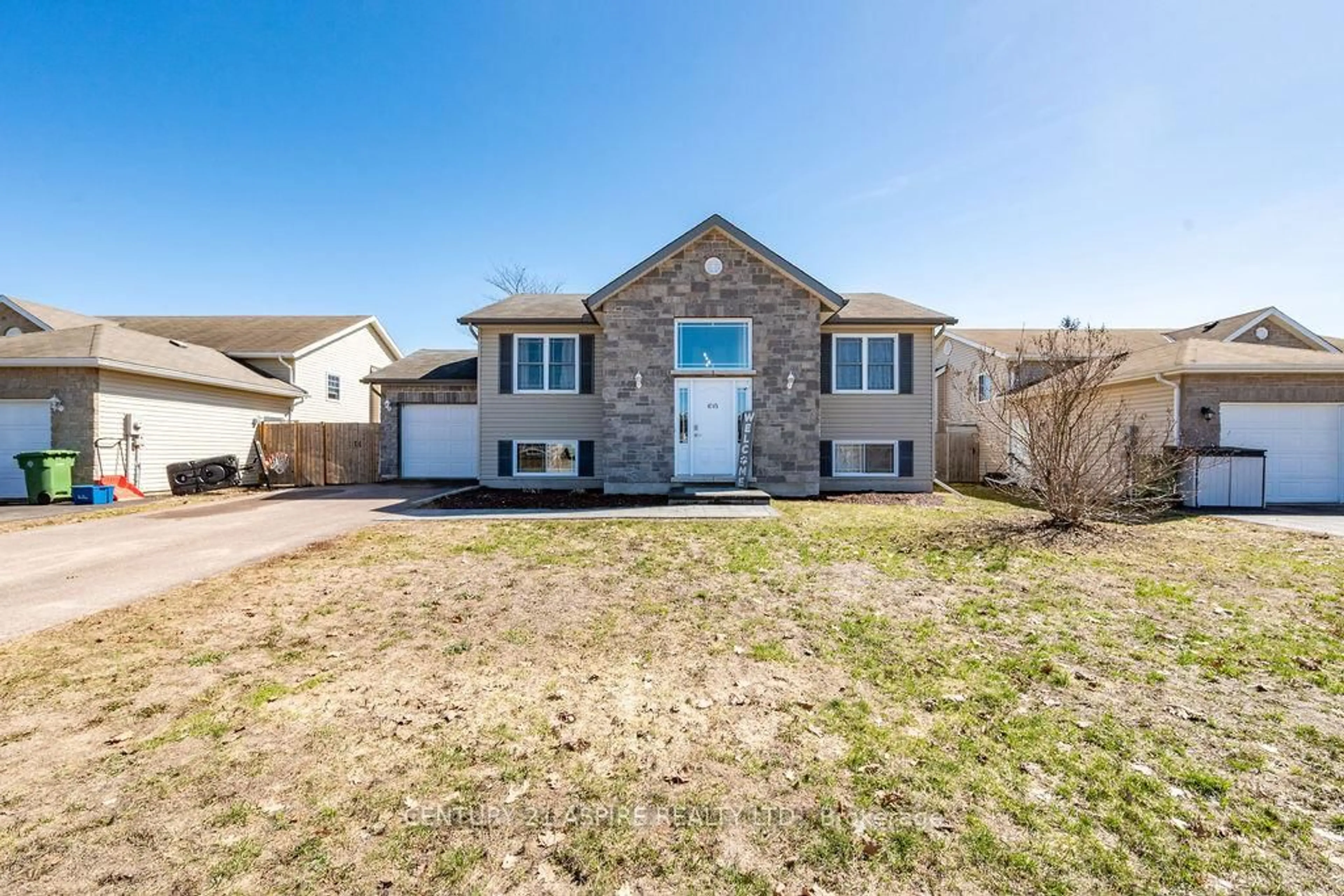 Home with brick exterior material, street for 1015 Riverstone Tr, Petawawa Ontario K8H 0B3