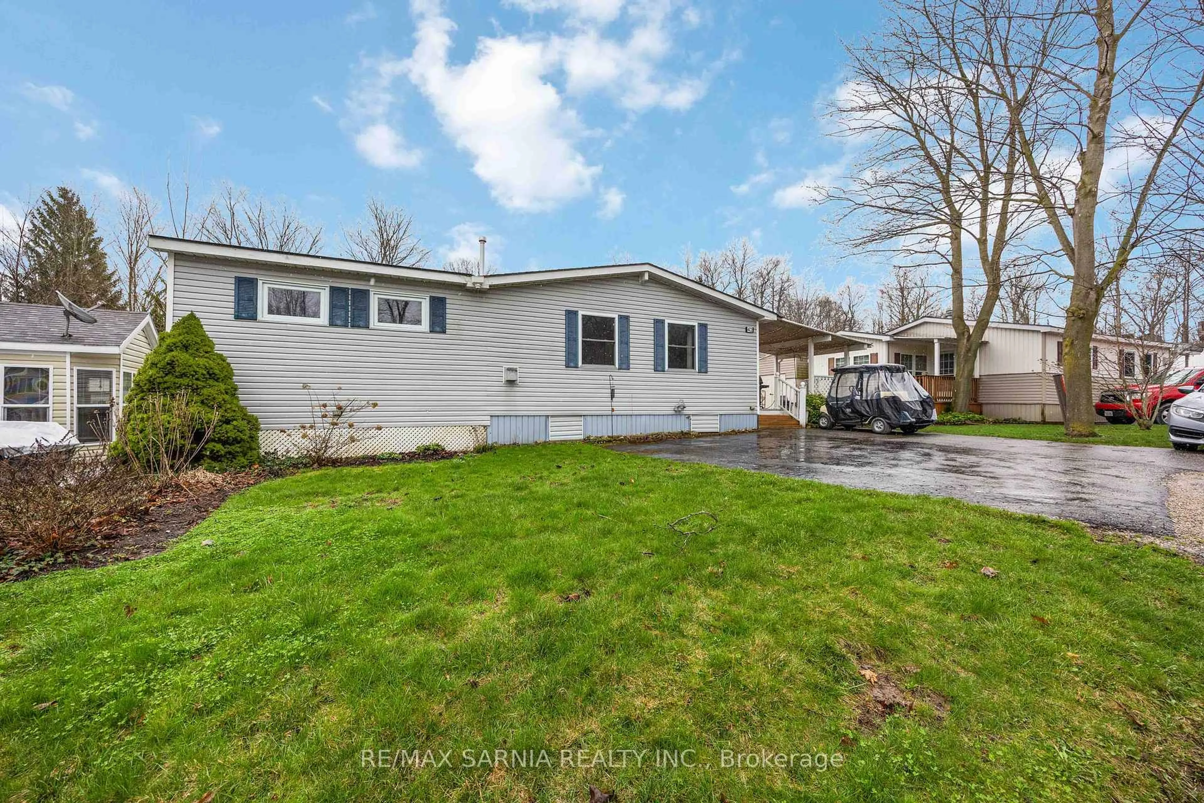 Home with vinyl exterior material, street for 4895 Lakeshore Rd #A42, Plympton-Wyoming Ontario N0N 1J6