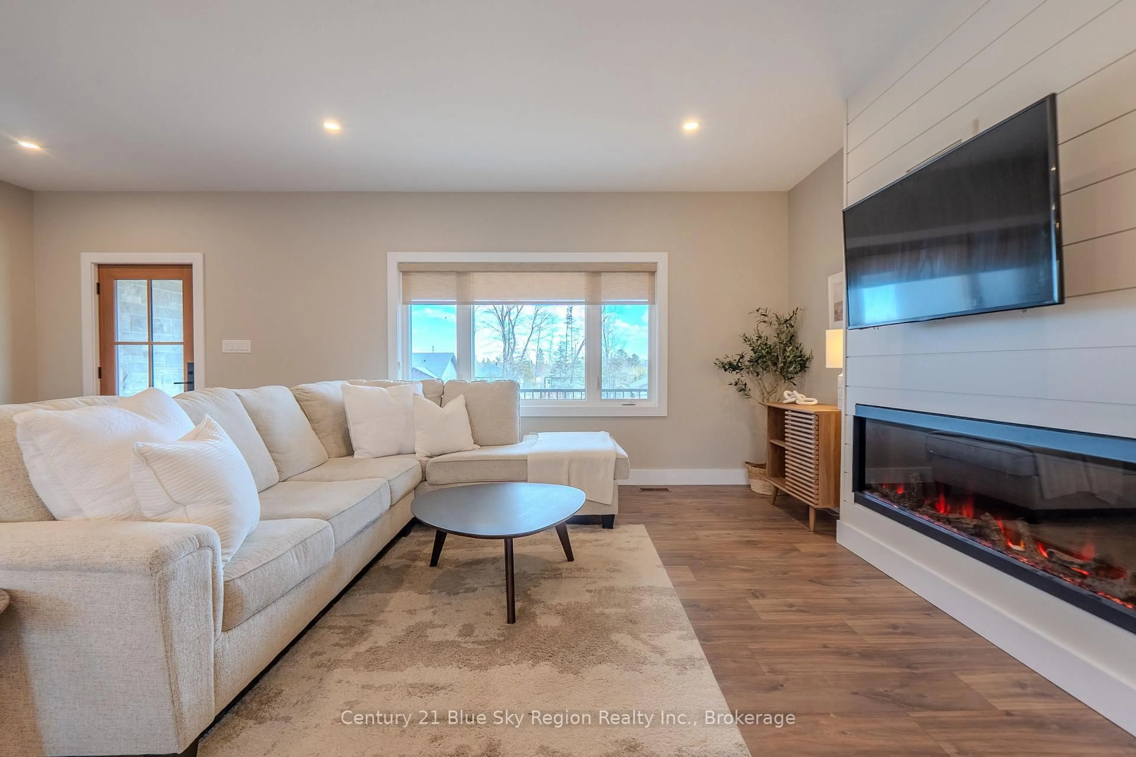 Living room with furniture, wood/laminate floor for 14 Evan Pl, North Bay Ontario P1B 0G8