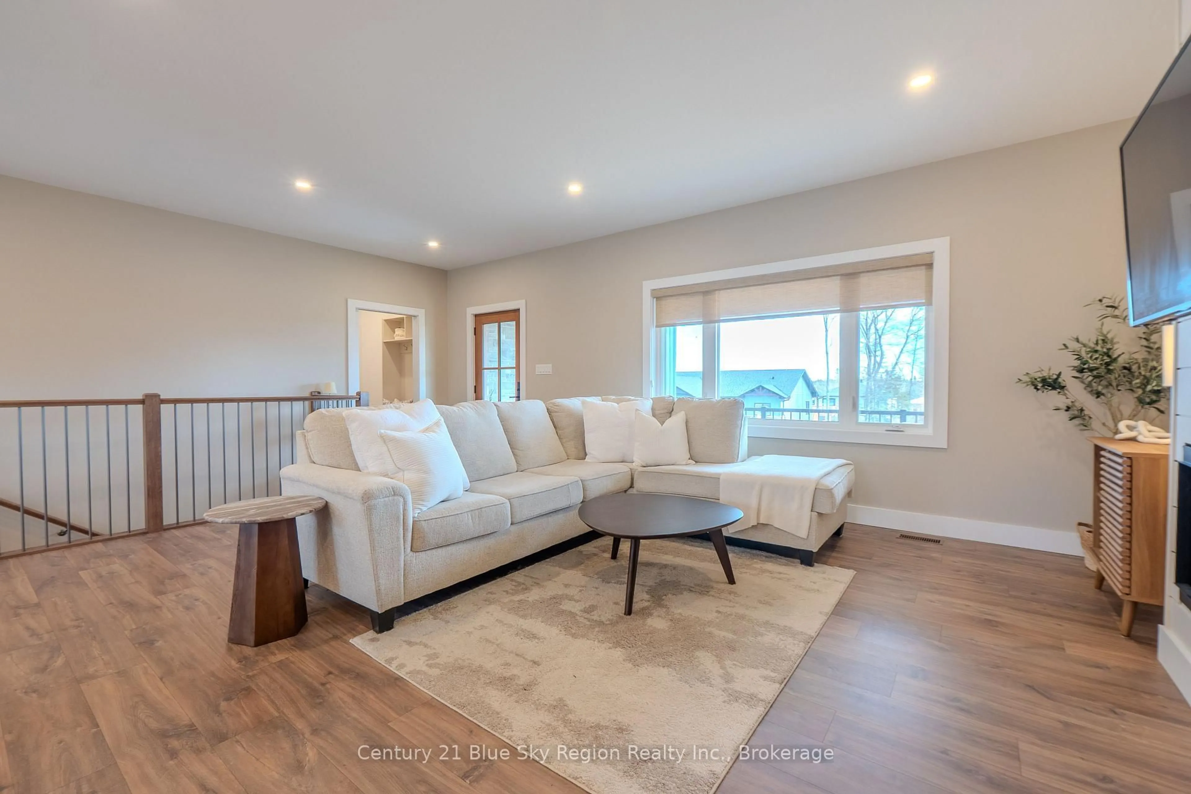 Living room with furniture, wood/laminate floor for 14 Evan Pl, North Bay Ontario P1B 0G8
