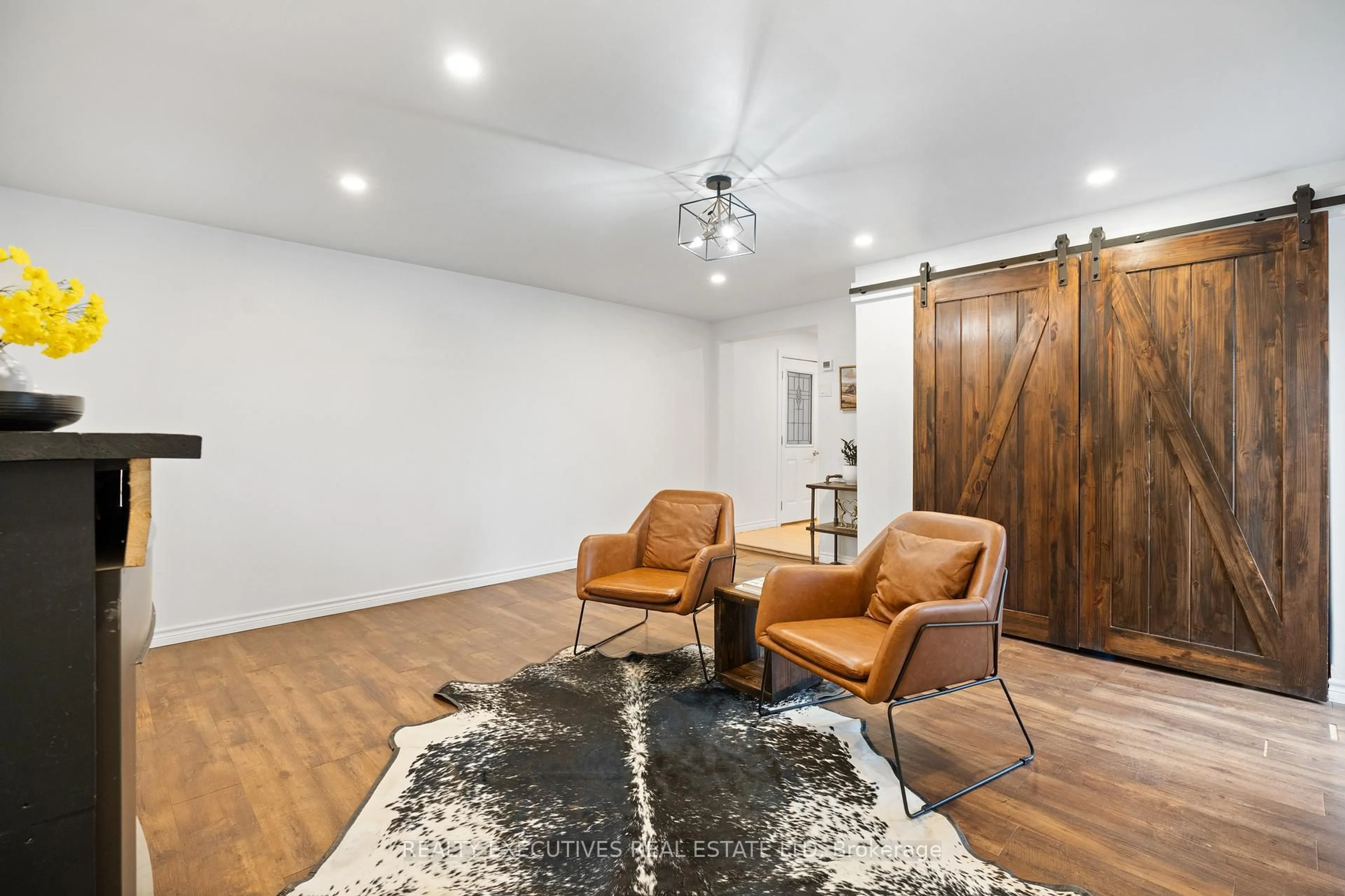 Living room with furniture, wood/laminate floor for 416 Main St, North Dundas Ontario K0C 2K0