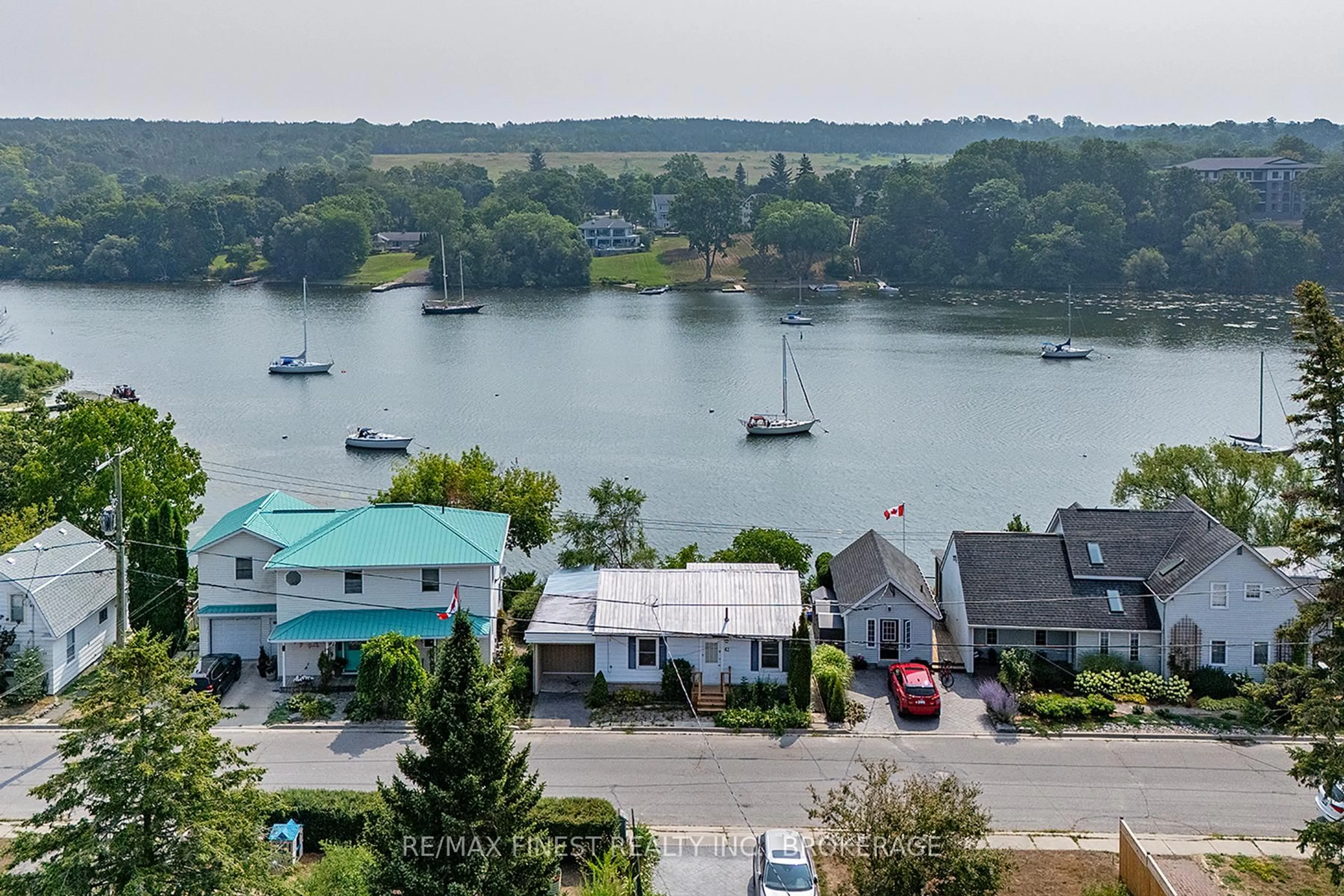 A pic from outside/outdoor area/front of a property/back of a property/a pic from drone, water/lake/river/ocean view for 42A HILL St, Prince Edward County Ontario K0K 2T0