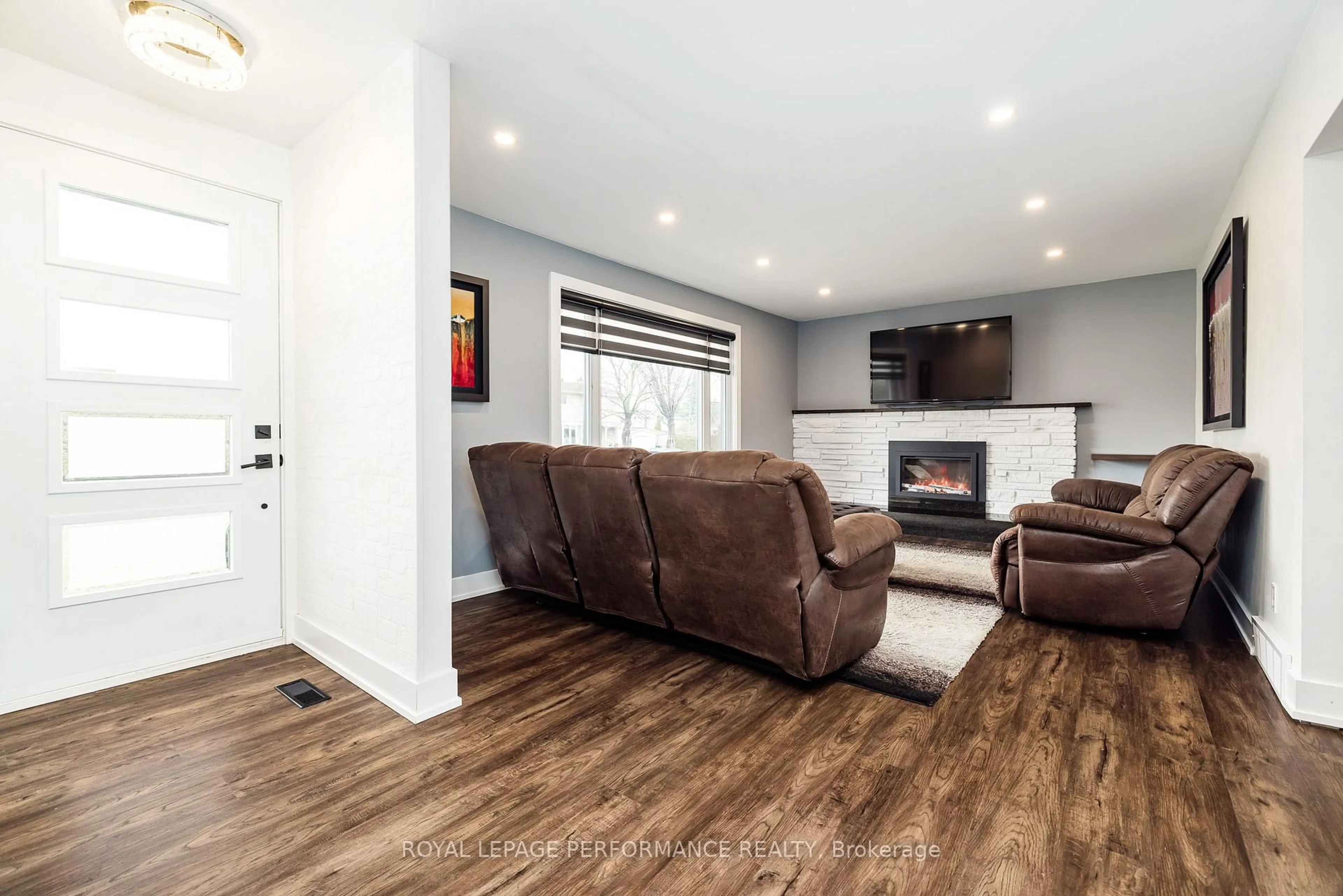 Living room with furniture, wood/laminate floor for 36 Largo Cres, Ottawa Ontario K2G 3C7