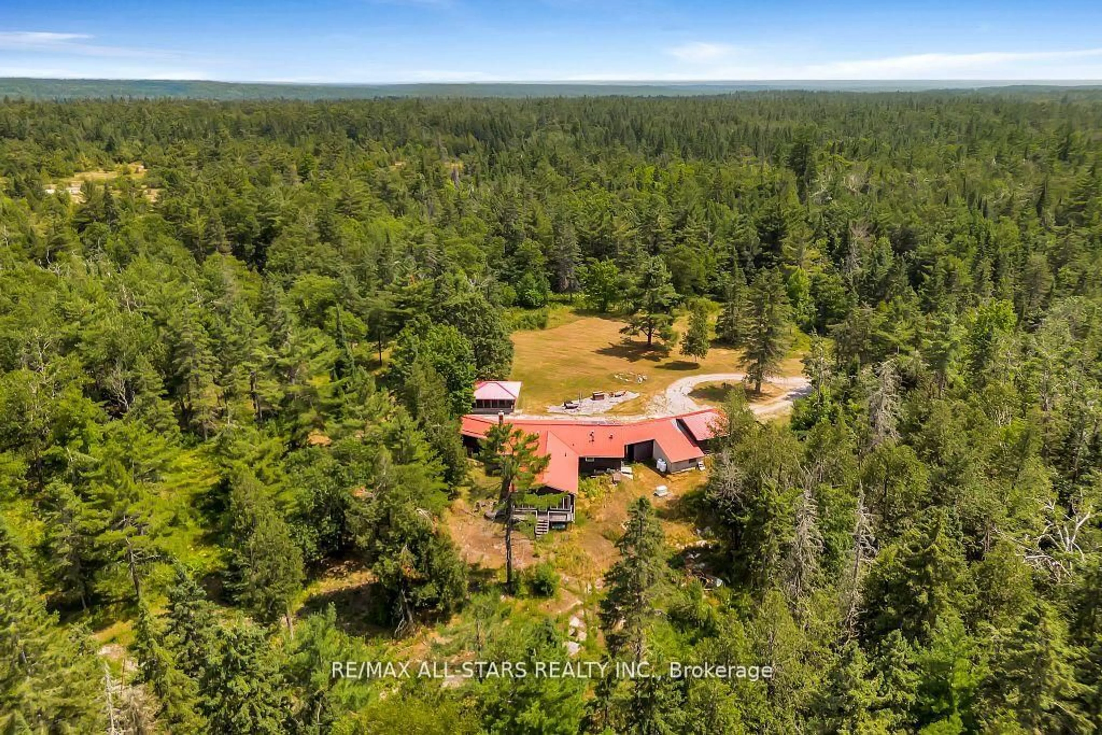 A pic from outside/outdoor area/front of a property/back of a property/a pic from drone, forest/trees view for 380 Ledge Rd, Trent Lakes Ontario K0M 1A0