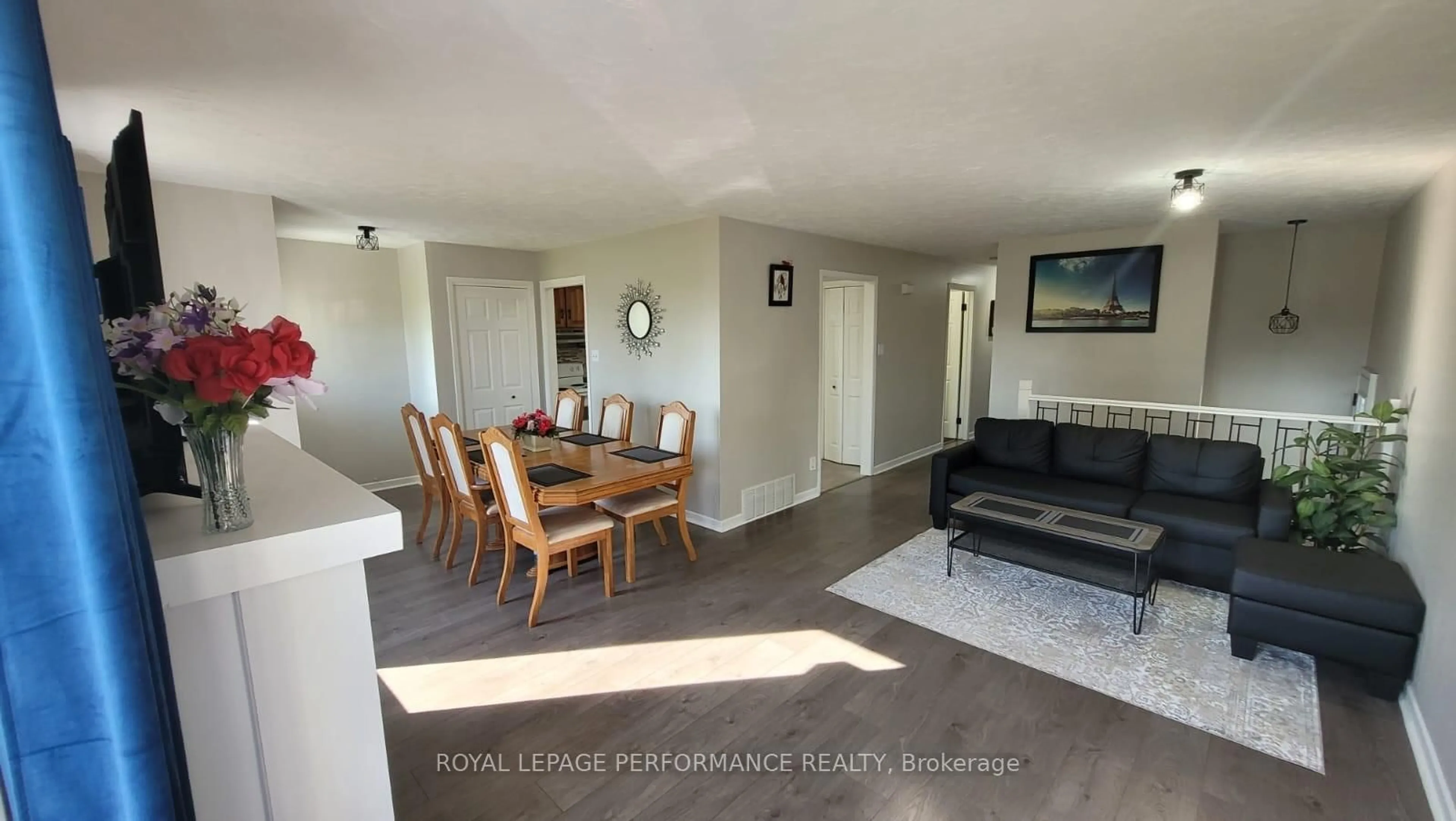 Living room with furniture, wood/laminate floor for 2261 Pitt St, Cornwall Ontario K6K 1A4