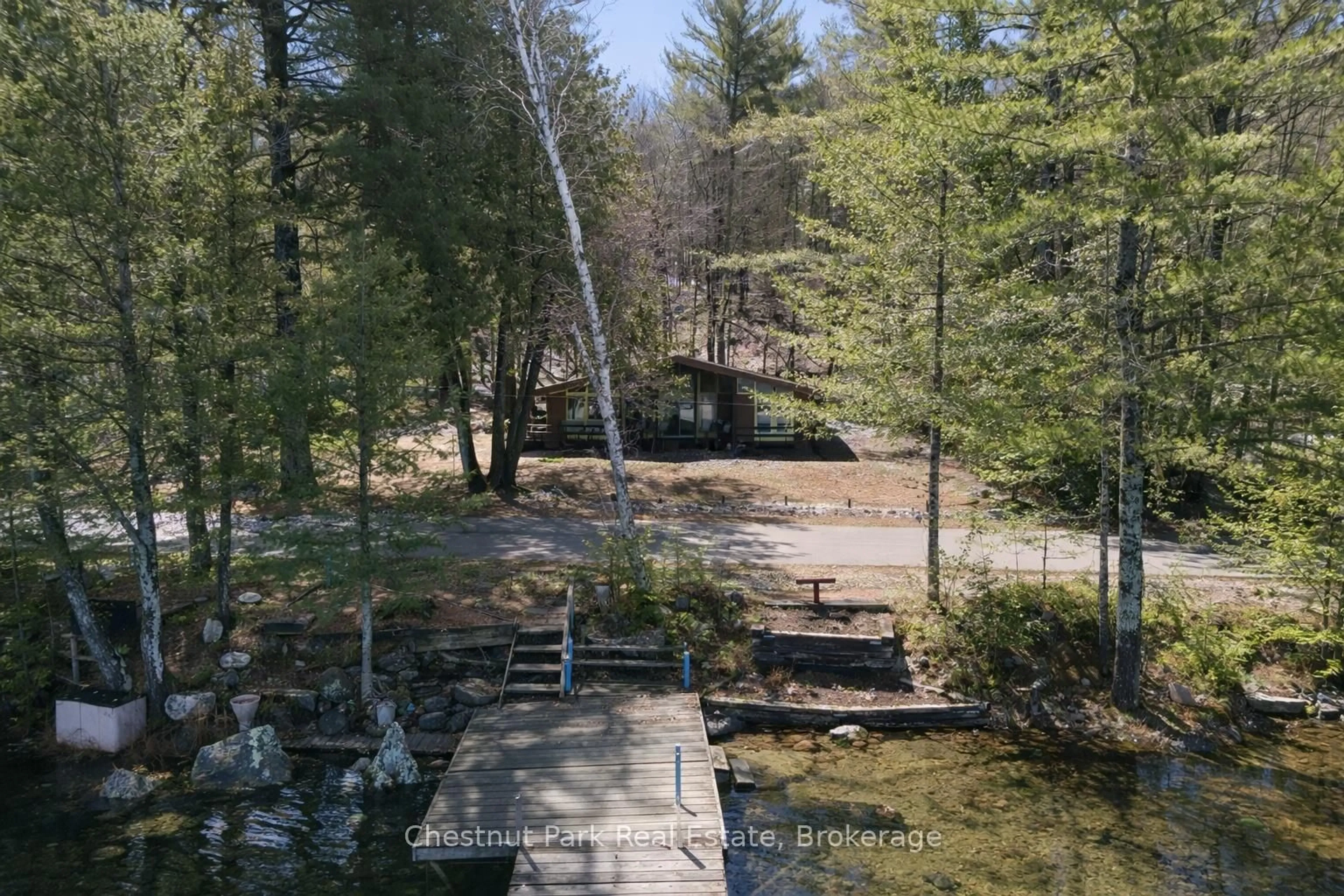A pic from outside/outdoor area/front of a property/back of a property/a pic from drone, forest/trees view for 1087 Glenmount Rd, Lake of Bays Ontario P0B 1A0