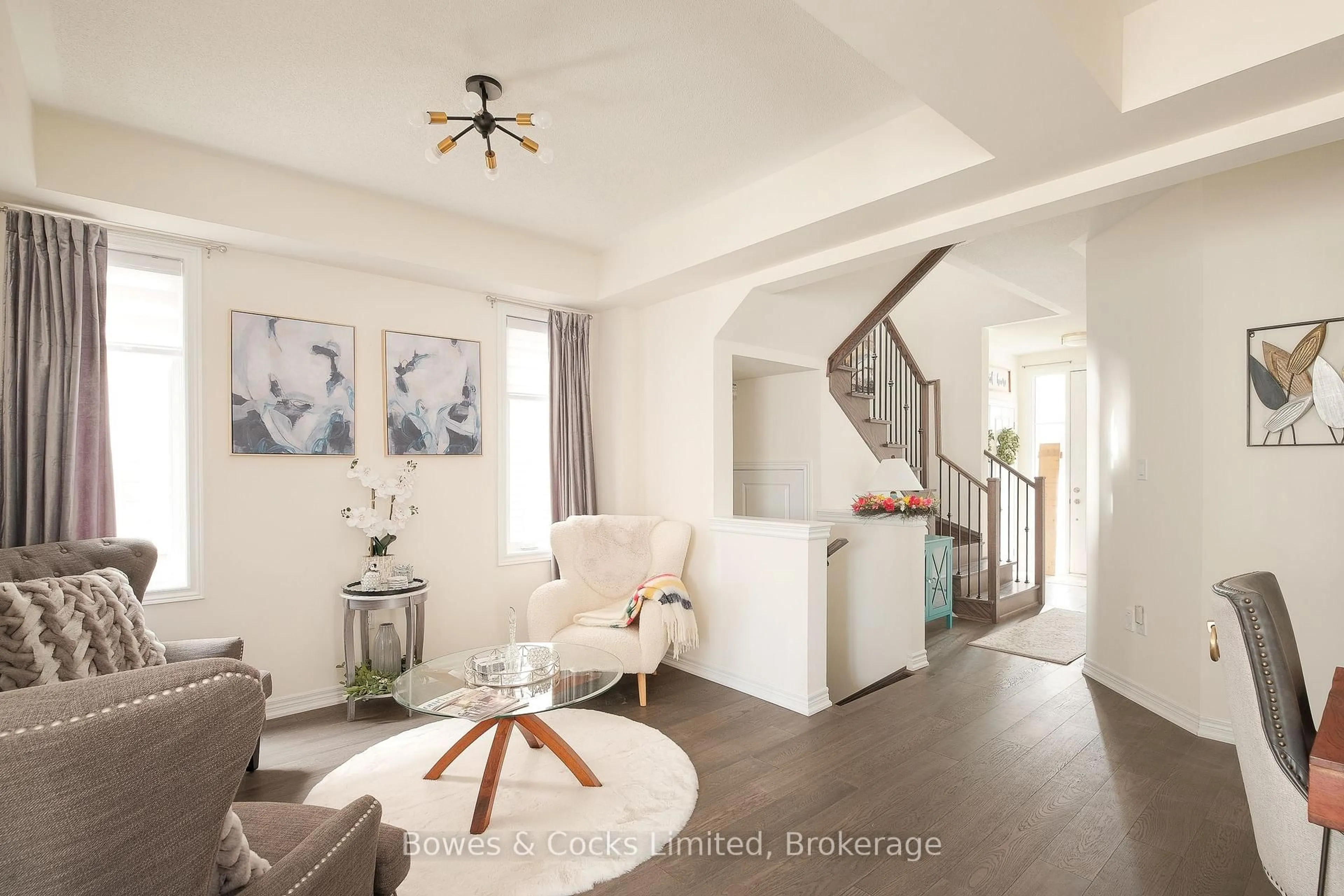 Living room with furniture, wood/laminate floor for 203 O'Neil St, Peterborough Ontario K9K 0H5