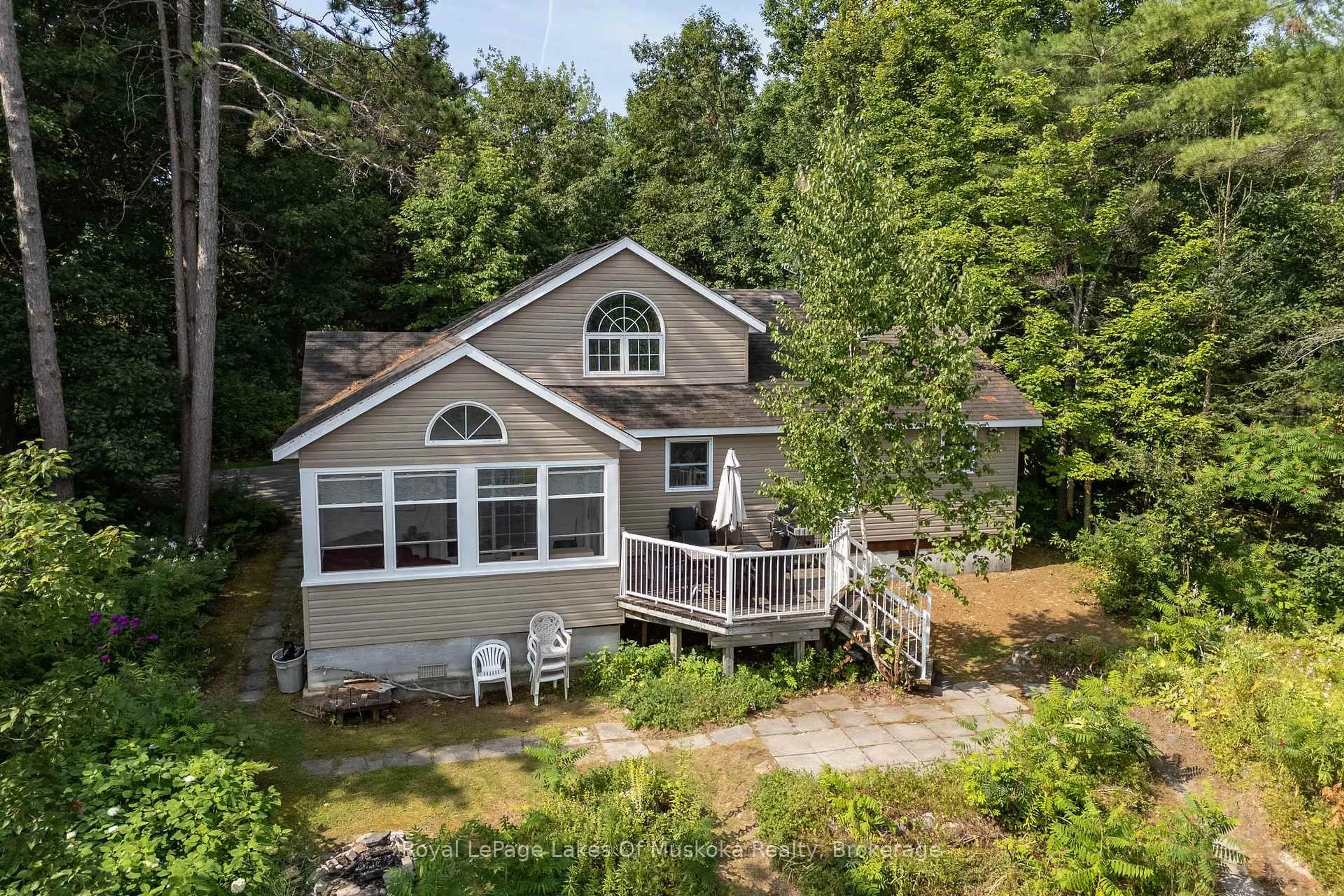 A pic from outside/outdoor area/front of a property/back of a property/a pic from drone, water/lake/river/ocean view for 49 Pinetree Rd, Gravenhurst Ontario P1P 1R2