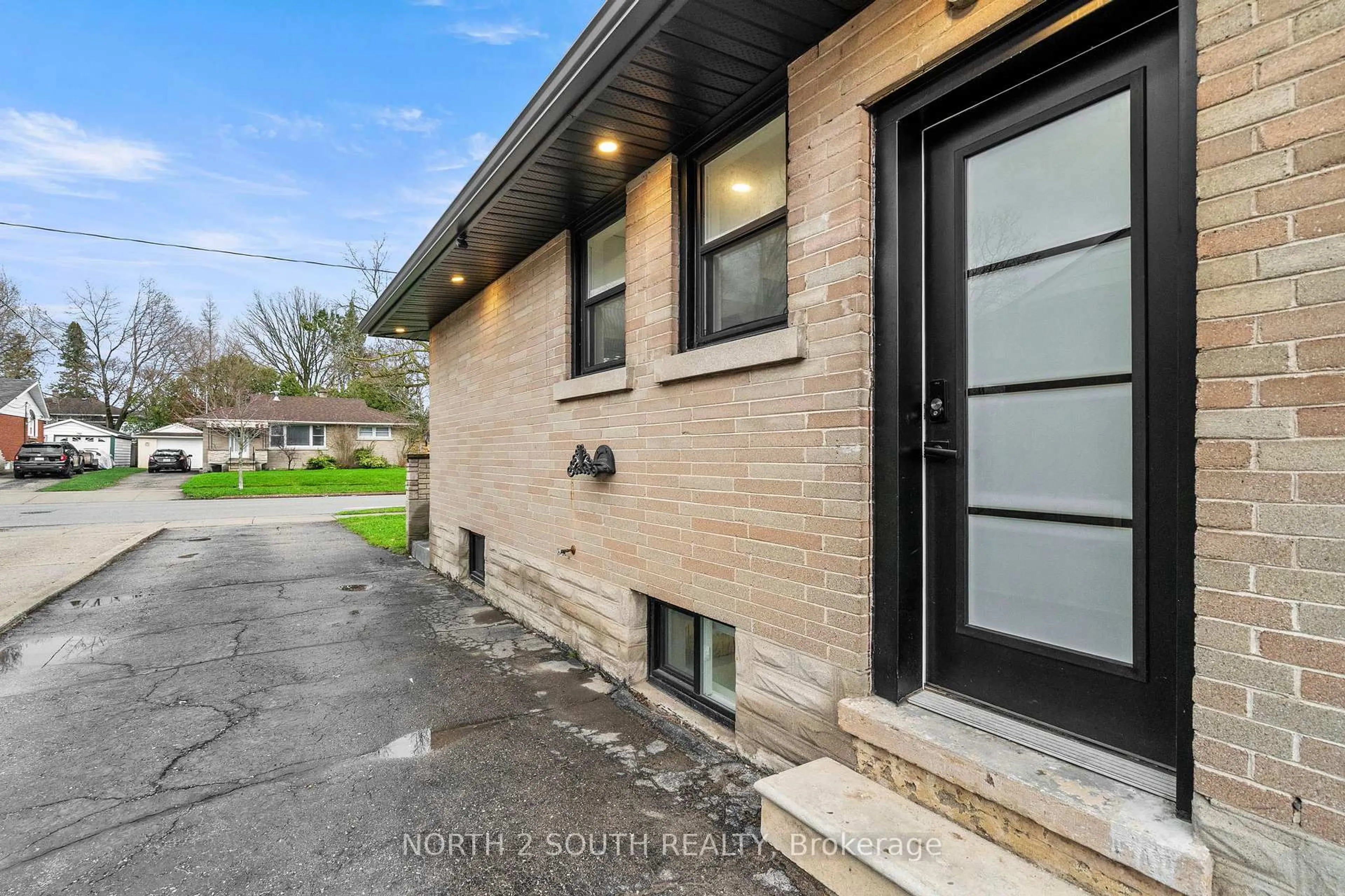 Home with brick exterior material, street for 81 Clark Ave, Kitchener Ontario N2C 1Y1