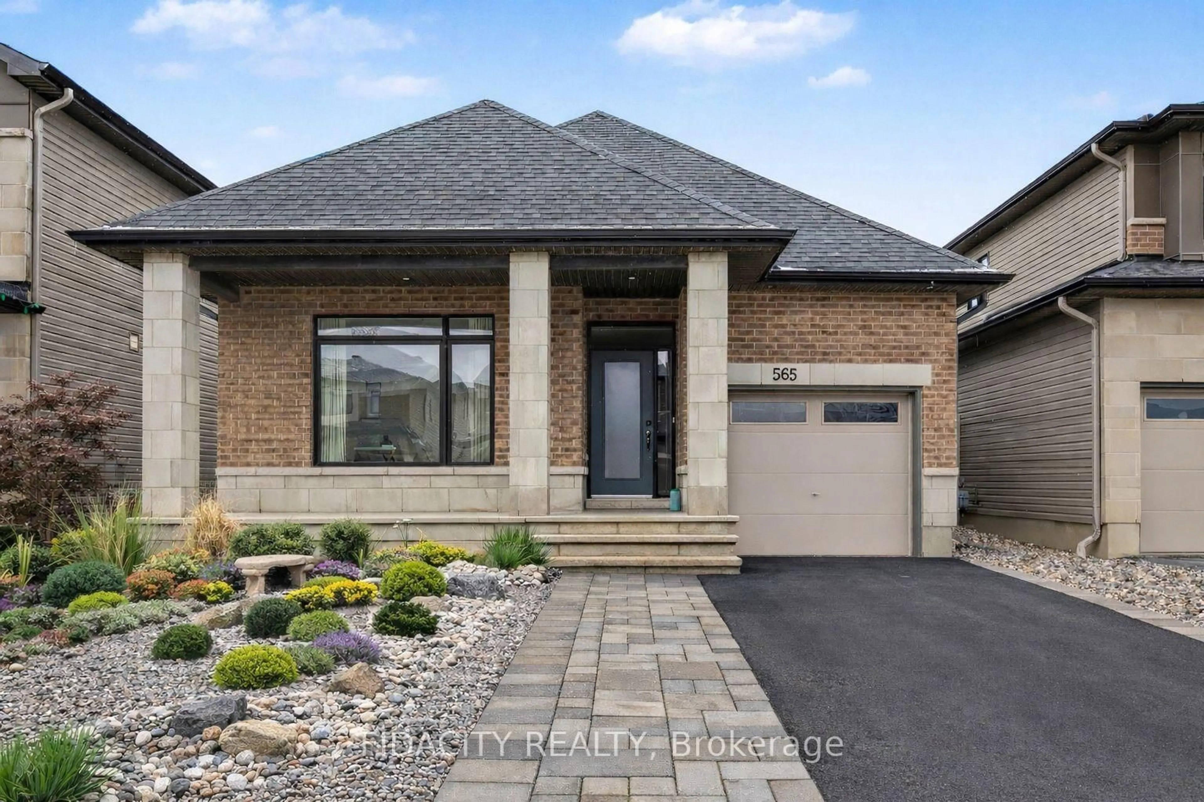 Home with brick exterior material, street for 565 Bobolink Rdge, Ottawa Ontario K2S 2P4