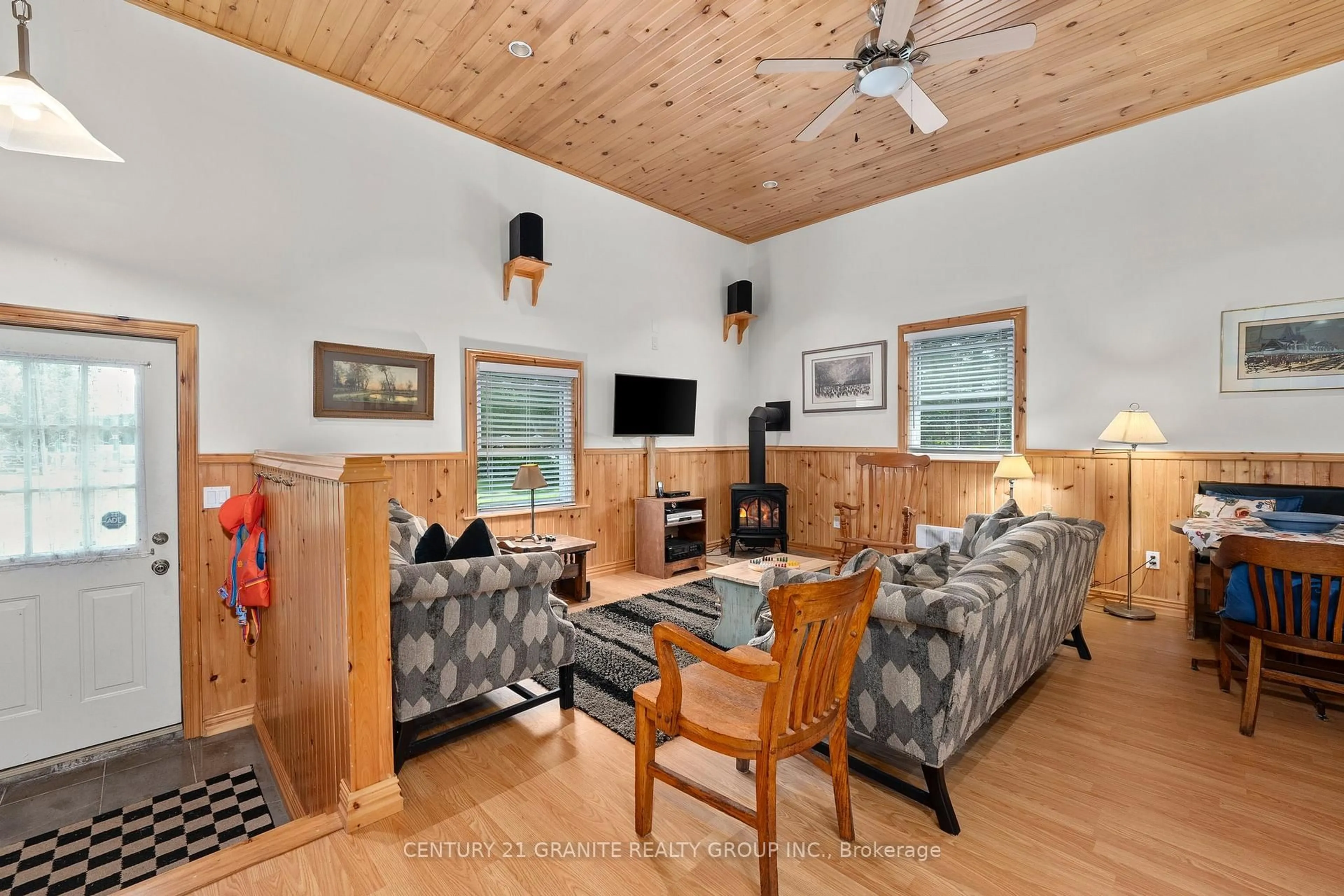Living room with furniture, wood/laminate floor for 3493 South Baptiste Lake Rd, Highlands East Ontario K0L 2A0
