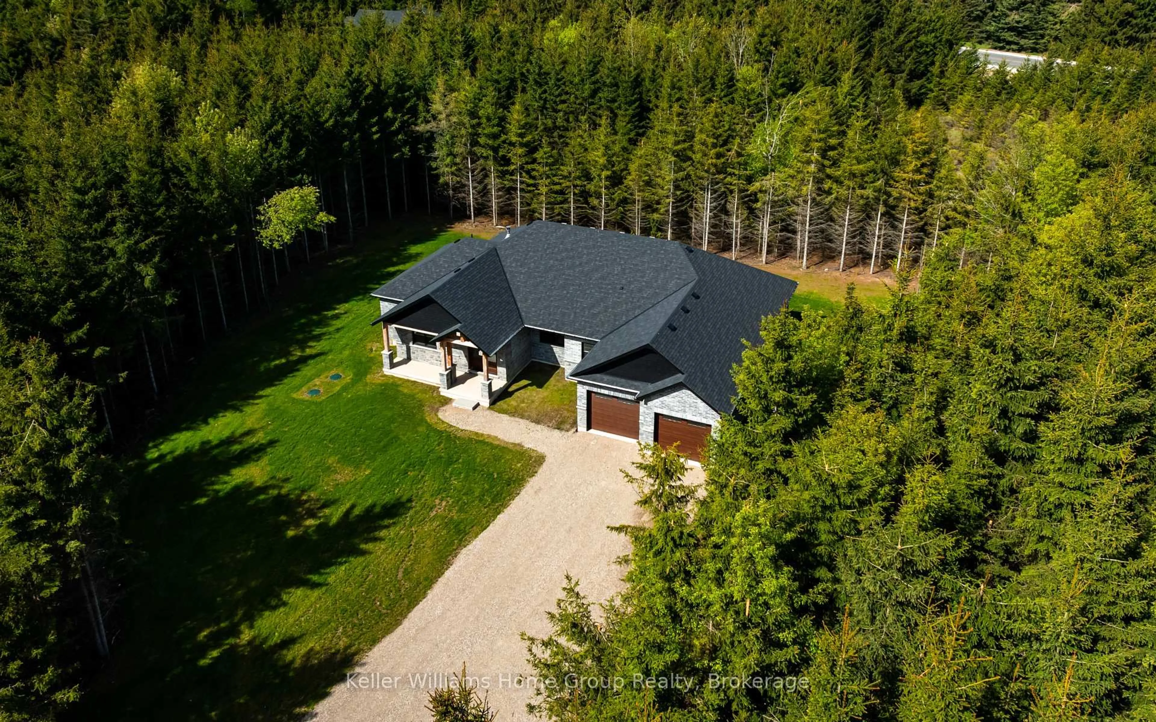 A pic from outside/outdoor area/front of a property/back of a property/a pic from drone, forest/trees view for 537266 Main St, Melancthon Ontario L0N 1J0