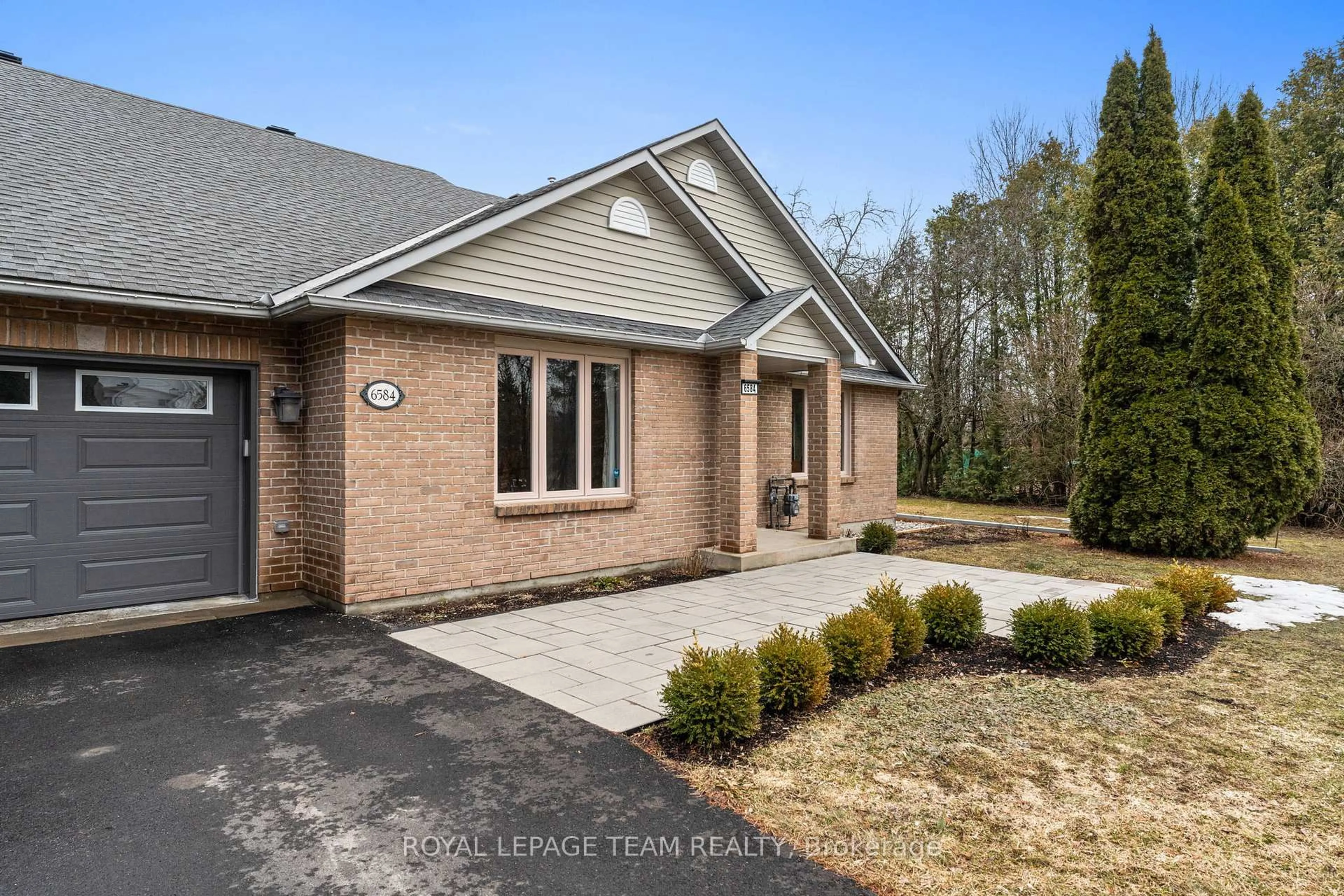 Home with brick exterior material, street for 6584 Harvest Grove Dr, Ottawa Ontario K4P 1E9