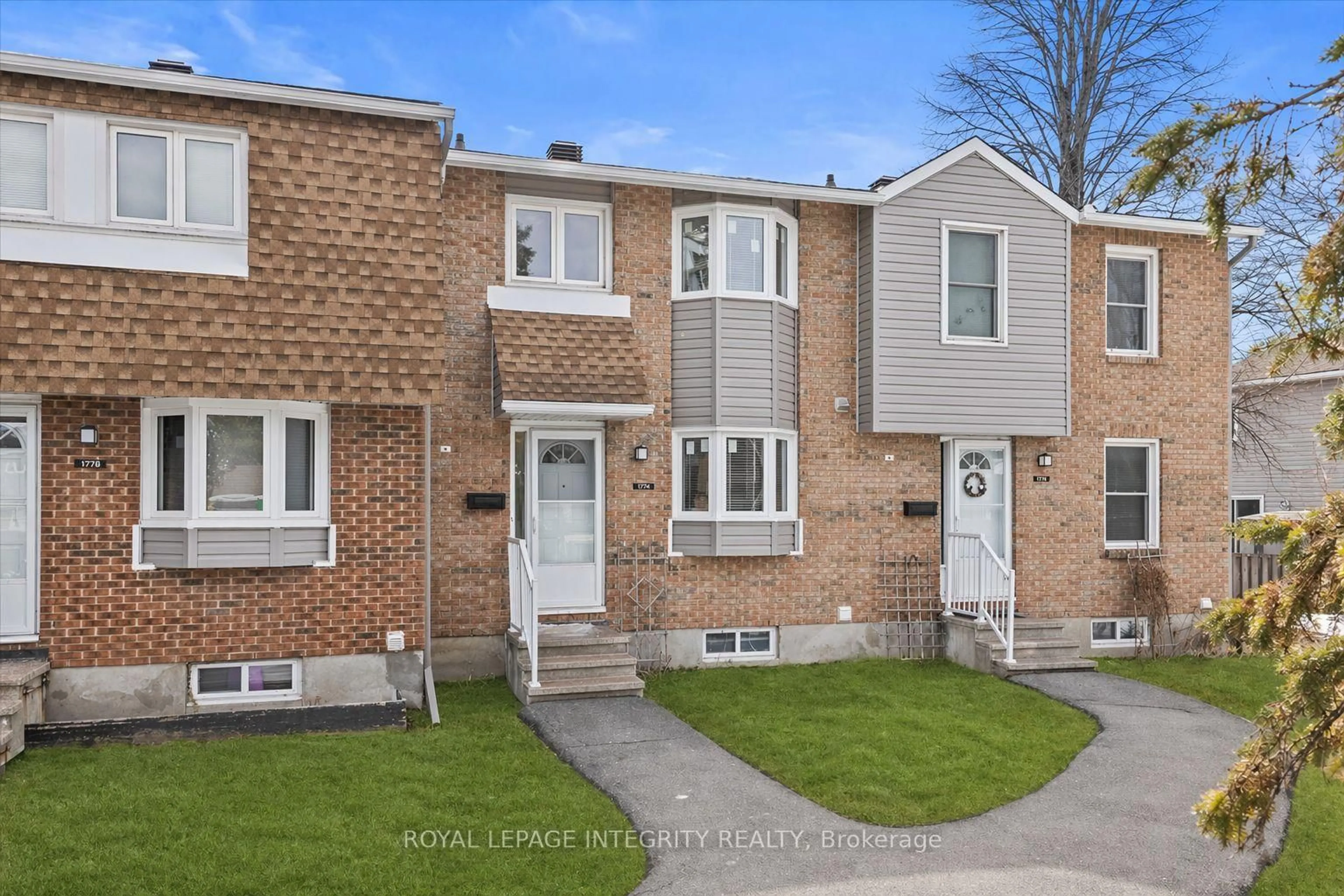 Home with brick exterior material, street for 1771 Lamoureux Dr #C, Ottawa Ontario K1E 2N5