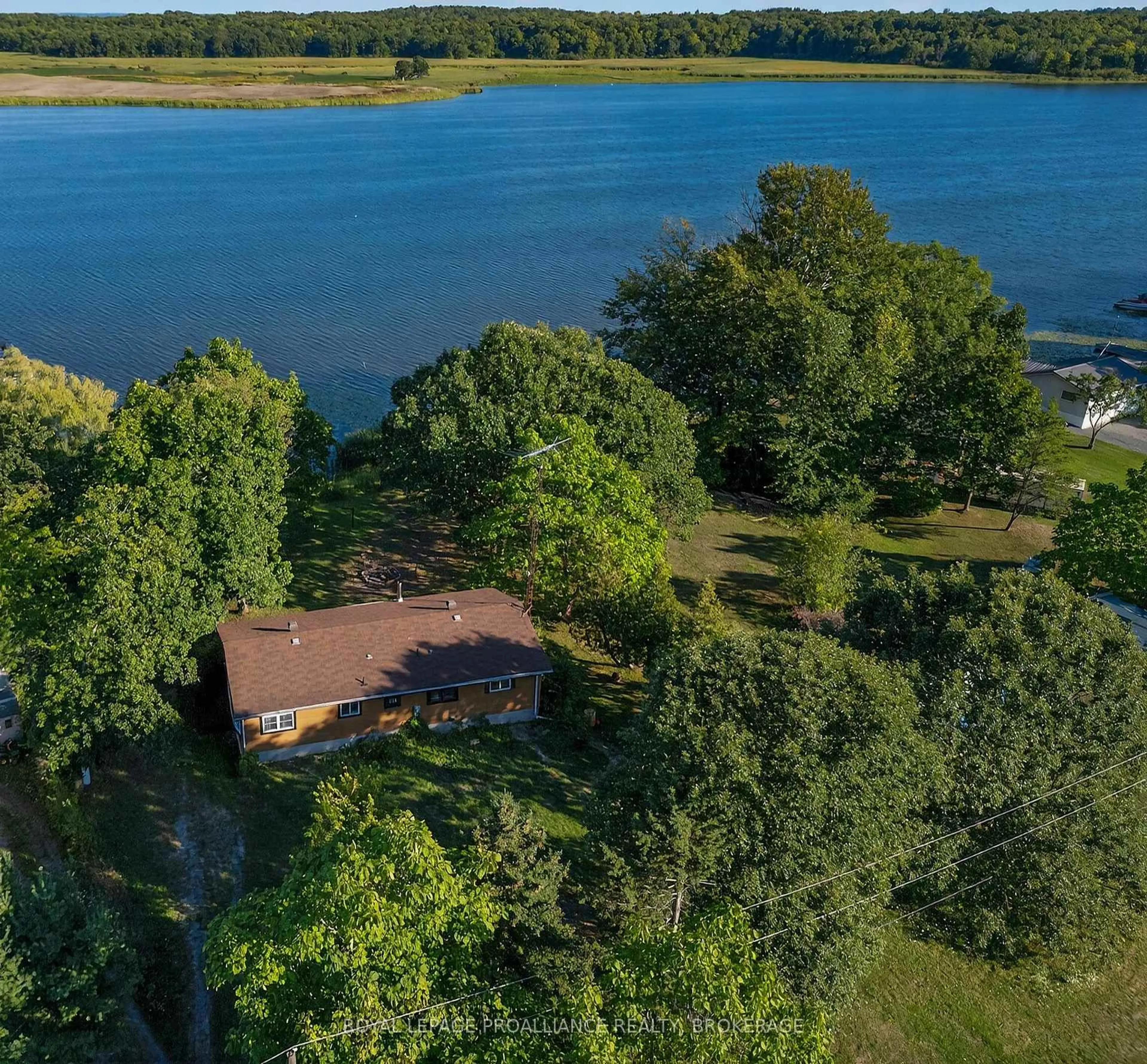 A pic from outside/outdoor area/front of a property/back of a property/a pic from drone, water/lake/river/ocean view for 225 Johnson Bay Lane, Gananoque Ontario K7G 2V6
