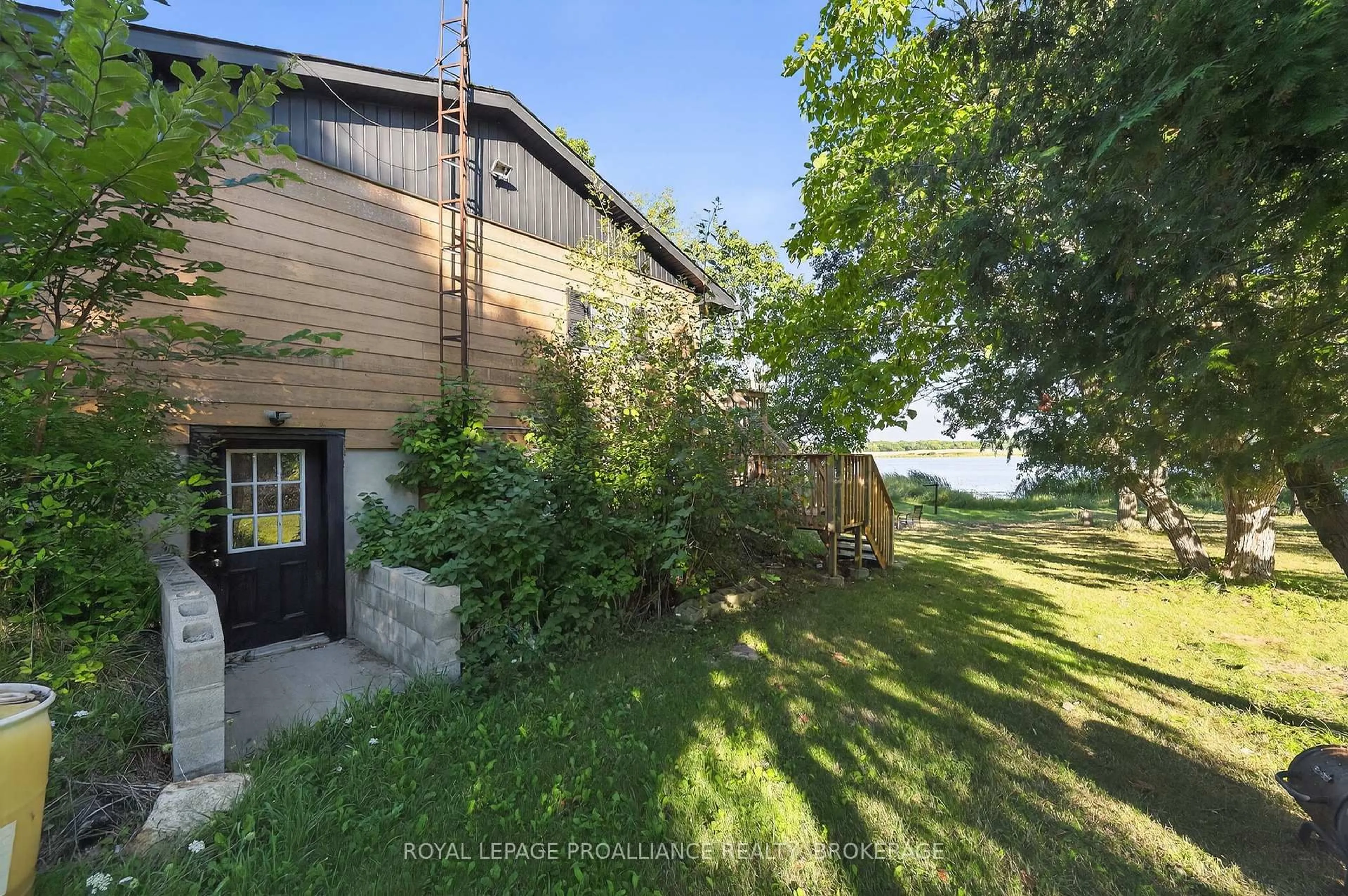 A pic from outside/outdoor area/front of a property/back of a property/a pic from drone, water/lake/river/ocean view for 225 Johnson Bay Lane, Gananoque Ontario K7G 2V6
