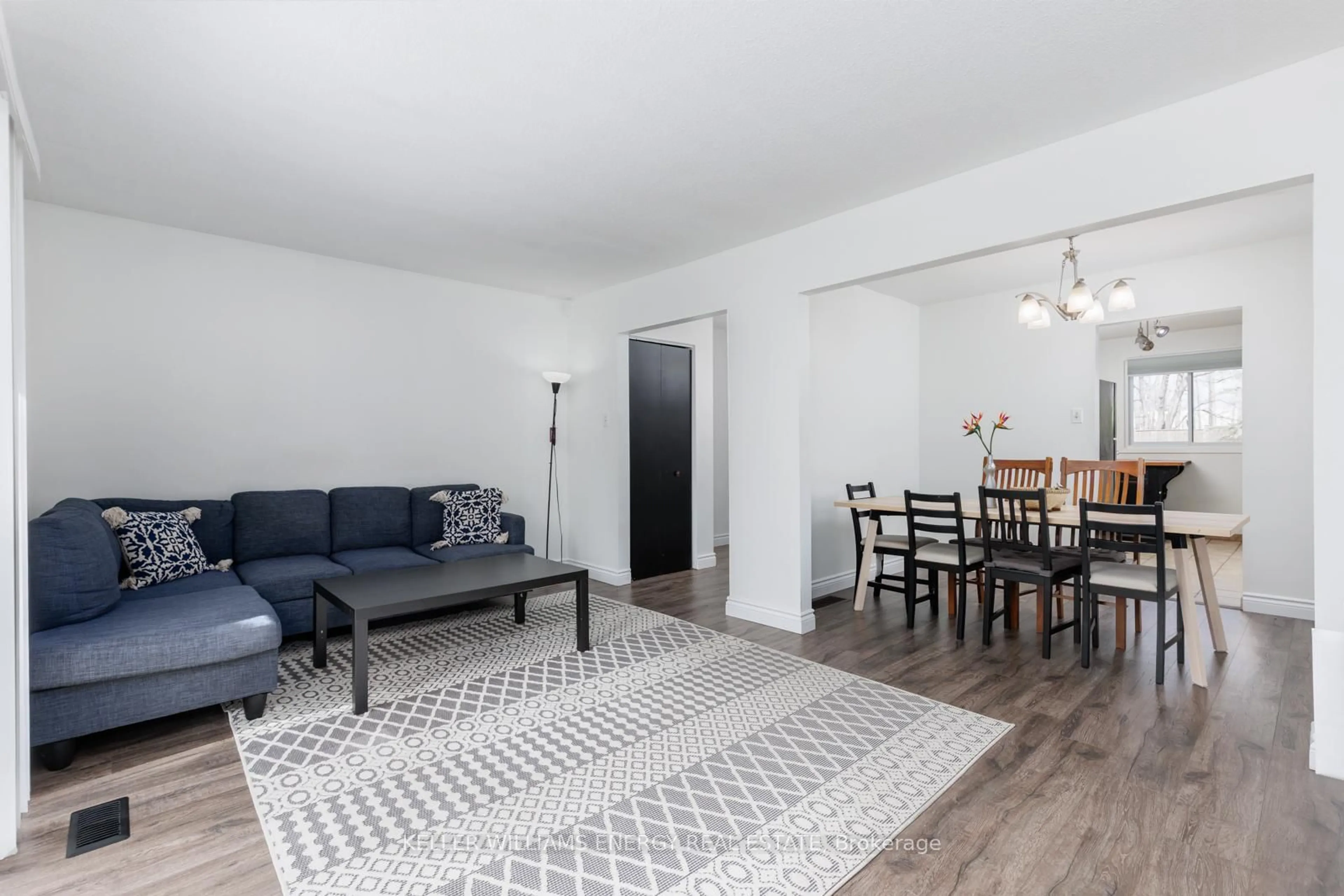 Living room with furniture, wood/laminate floor for 660 Grey St #B, Brantford Ontario N3S 4Y4