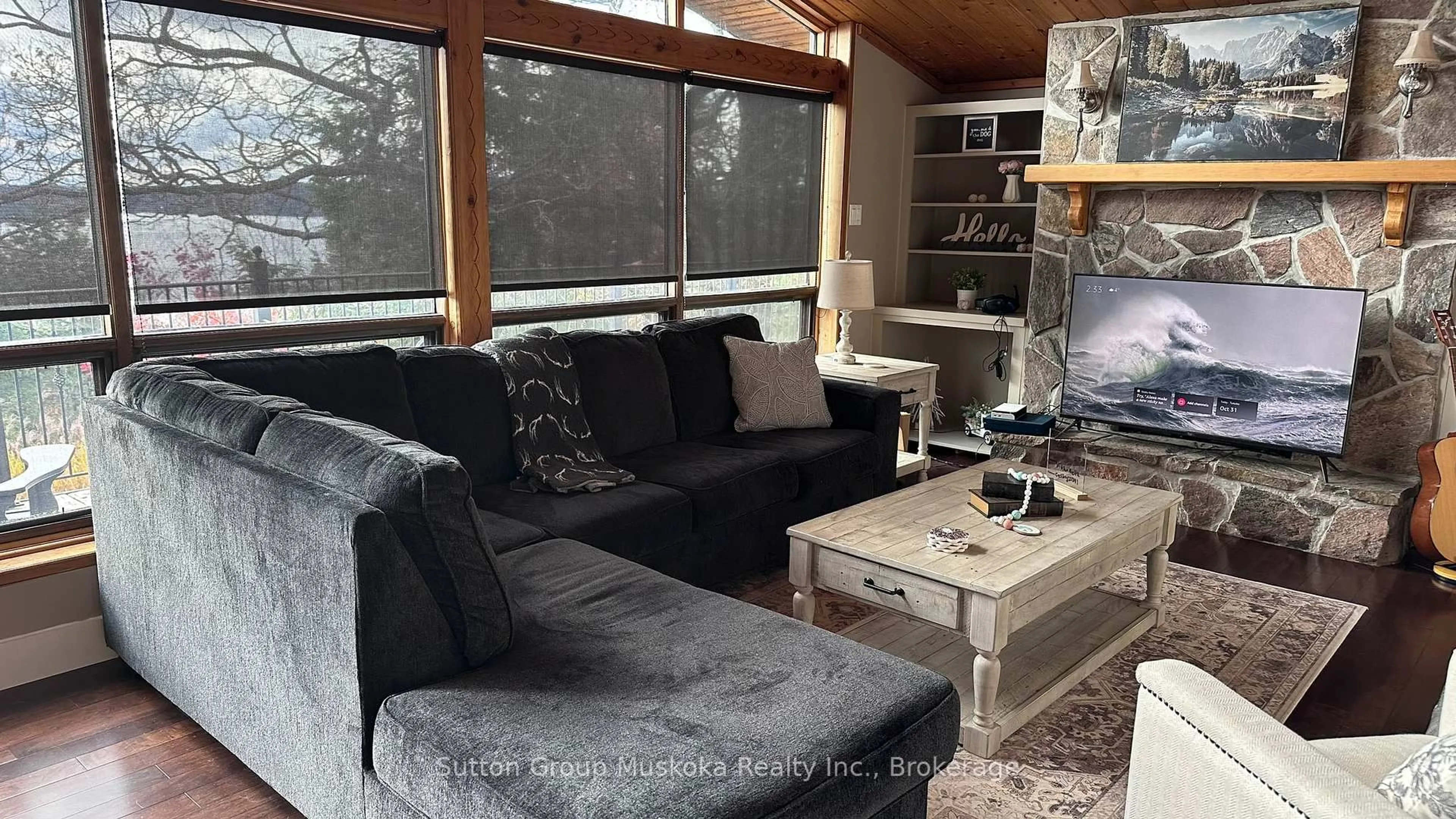 Living room with furniture, wood/laminate floor for 165 Golden Pheasant Dr, Huntsville Ontario P1H 1B3