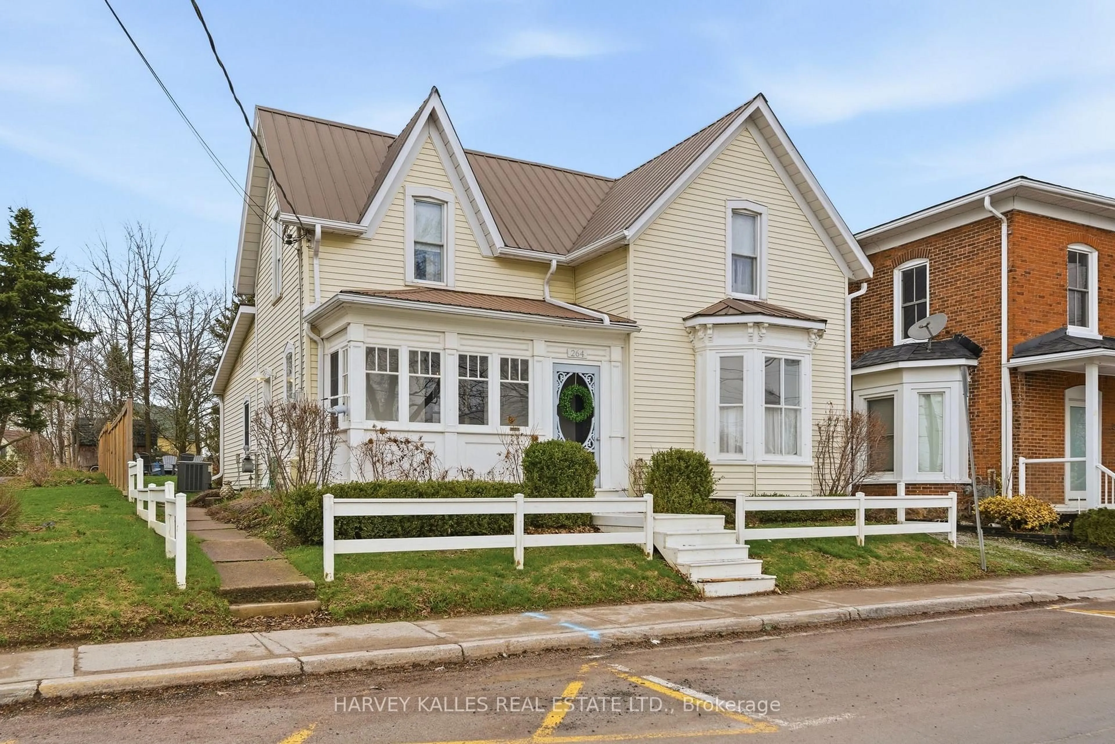 Home with vinyl exterior material, street for 264 Main St, Prince Edward County Ontario K0K 1G0