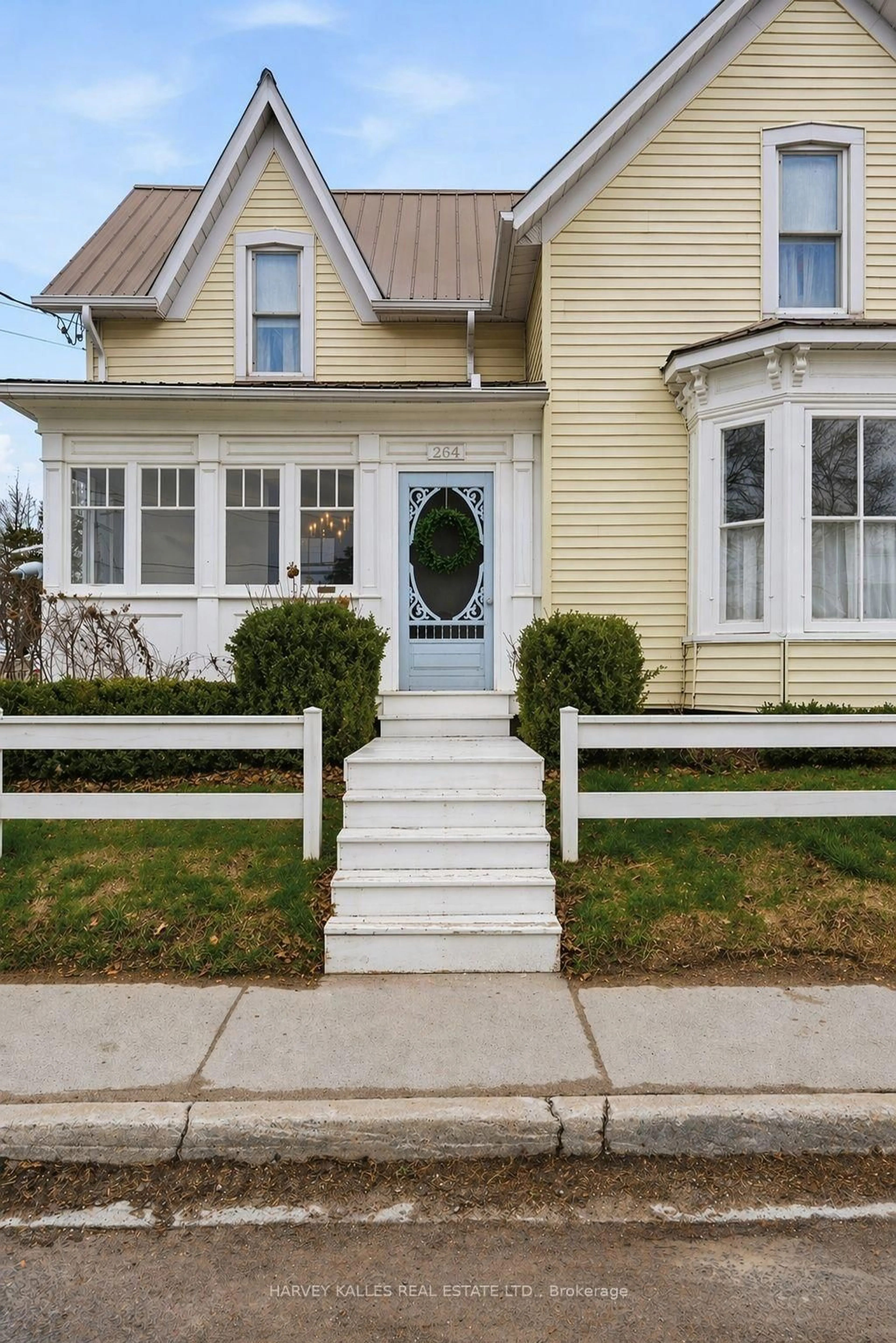 Home with vinyl exterior material, street for 264 Main St, Prince Edward County Ontario K0K 1G0